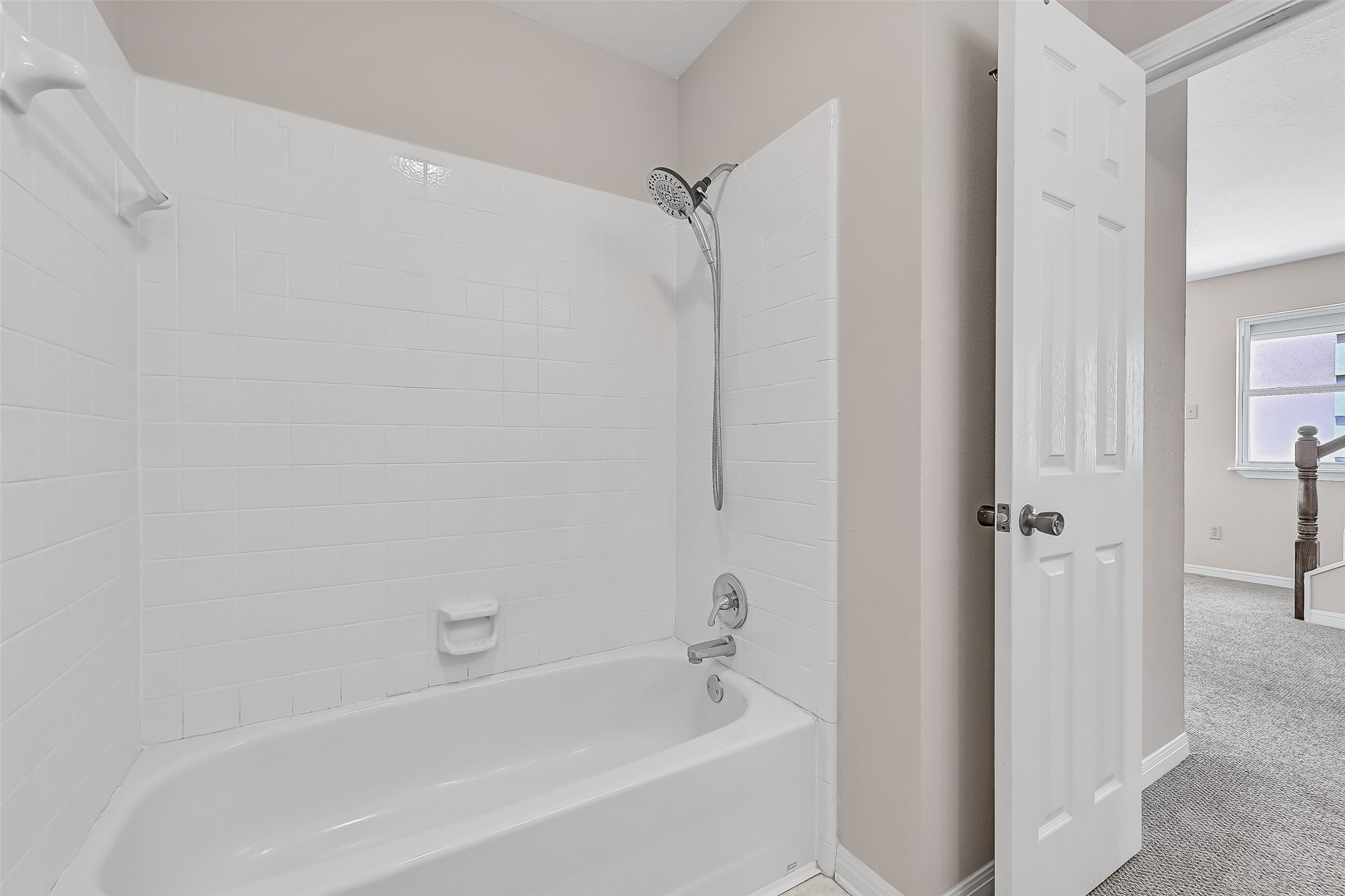 Serving the secondary bedroom and main living areas, this full bath includes a tub/shower combination and practical layout, providing comfortable accommodations for guests, family members, or visitors enjoying the waterfront lifestyle.