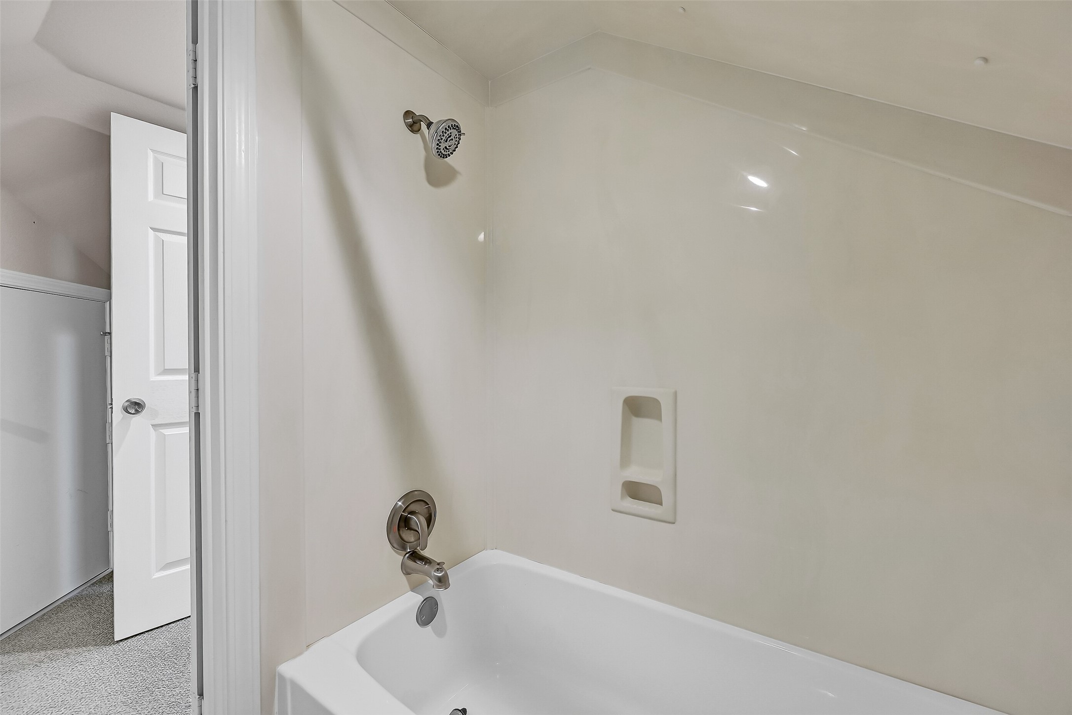 The upstairs bathroom features a large vanity with abundant storage and a bright, airy feel. Positioned between the adjoining flex spaces, it creates a comfortable private retreat for overnight guests.