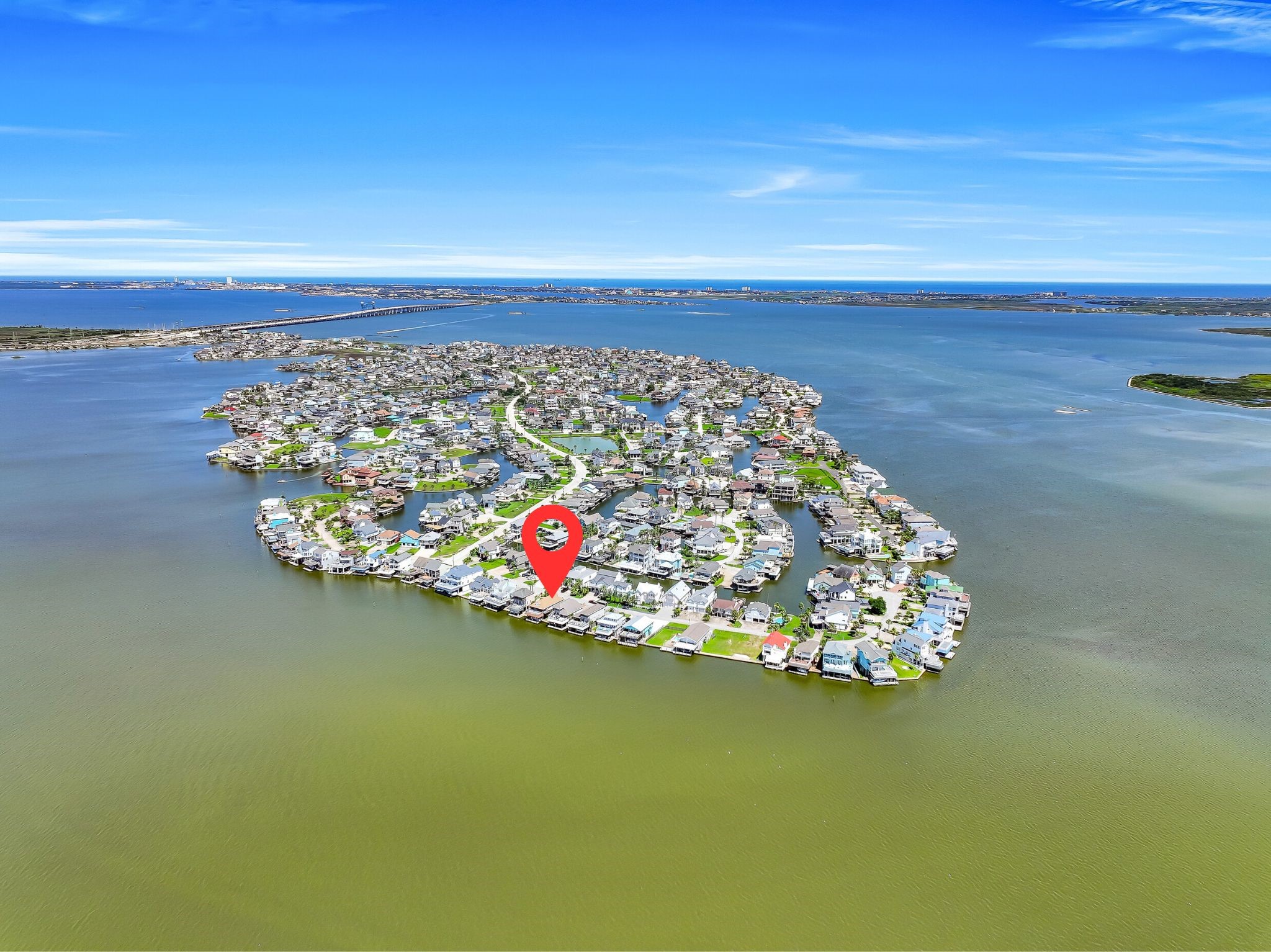A bird's-eye view reveals the unique beauty of Tiki Island, where canals, bayfront homes, boating, fishing, and waterfront sunsets define daily life. Whether you're searching for a weekend retreat or a full-time coastal residence, this is an opportunity to enjoy some of the most spectacular waterfront living on the Texas coast.