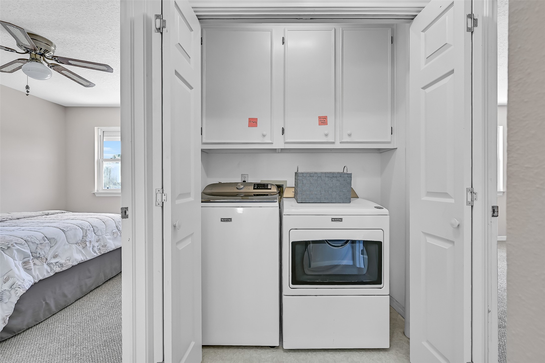 A dedicated utility closet is conveniently located on the main living level, just steps from the primary suite. Having laundry on the same floor as the primary bedroom adds another layer of convenience to this thoughtfully designed waterfront home.