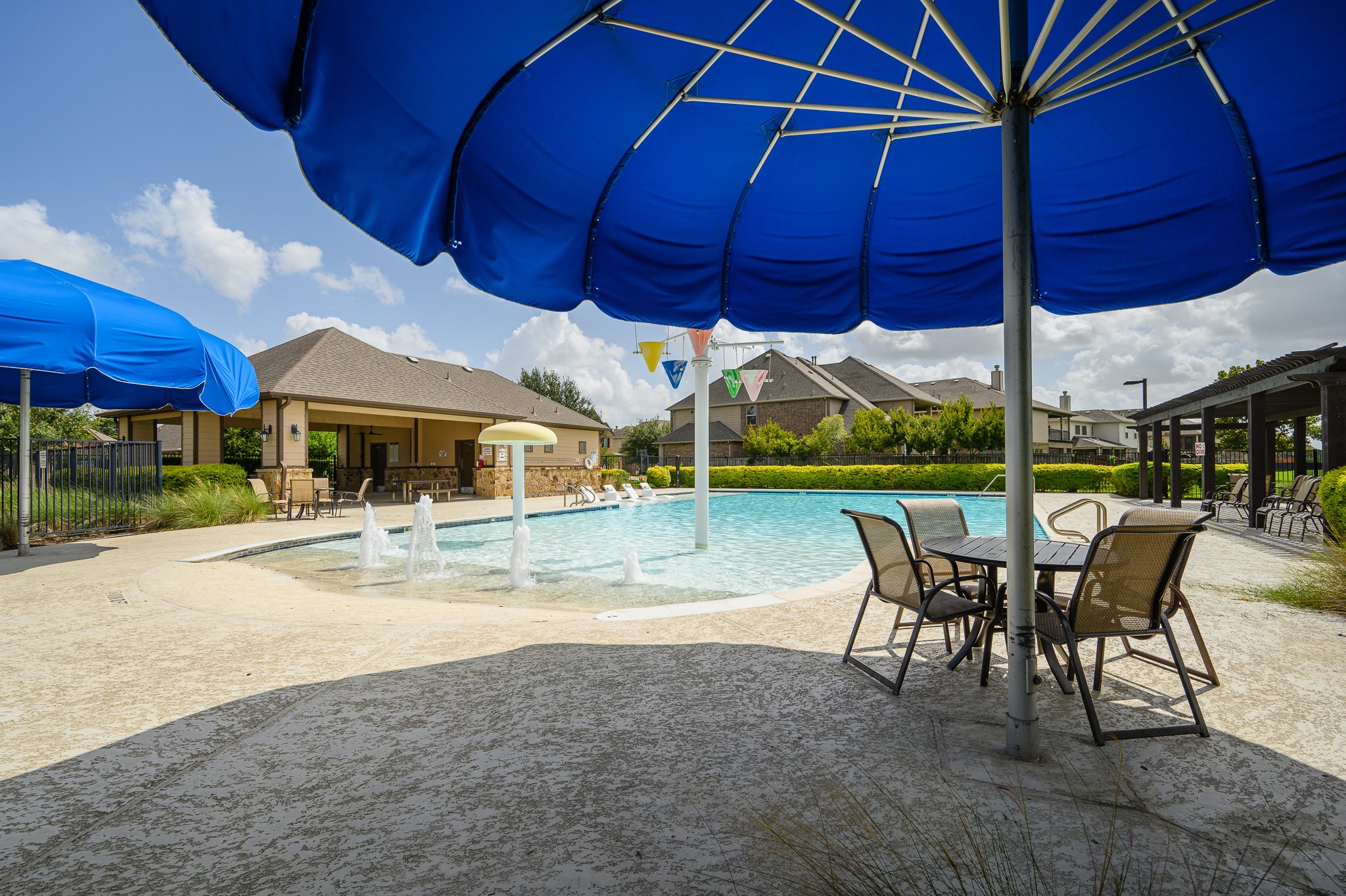 Indulge in resort-style living with a sparkling pool, shaded seating, and a stylish clubhouse perfect for relaxation and entertaining.