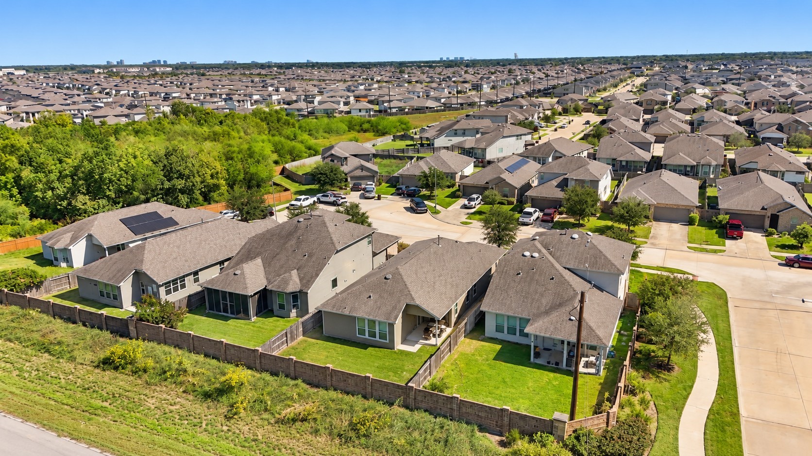 Elevated neighborhood view showcases the surrounding residential community and nearby green spaces.