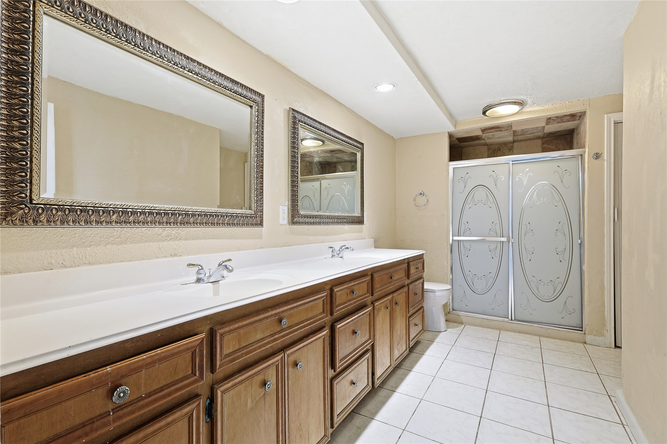 Huge Bathroom with double sinks and a large walk in shower