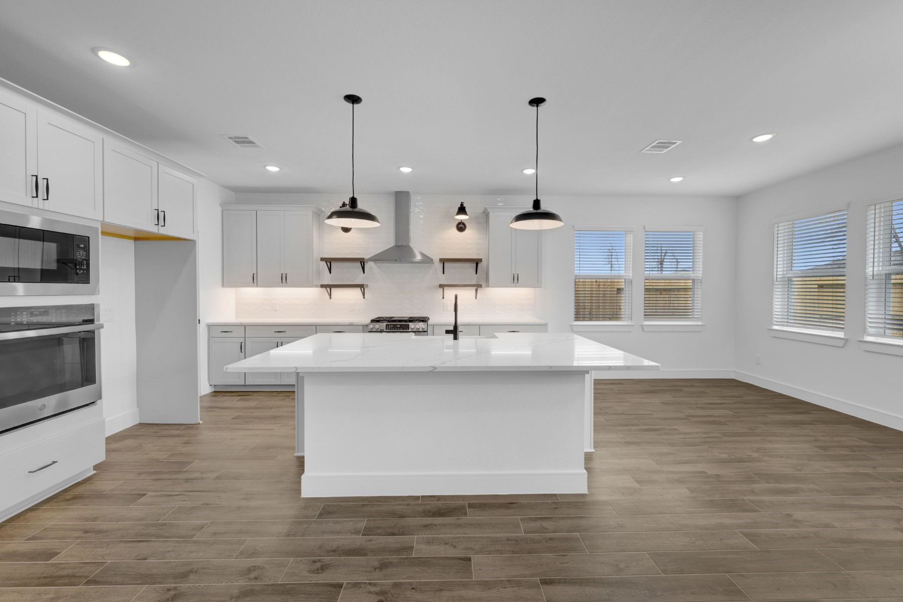 Stylish island kitchen (*Photo not of actual home and used for illustration purposes only.)