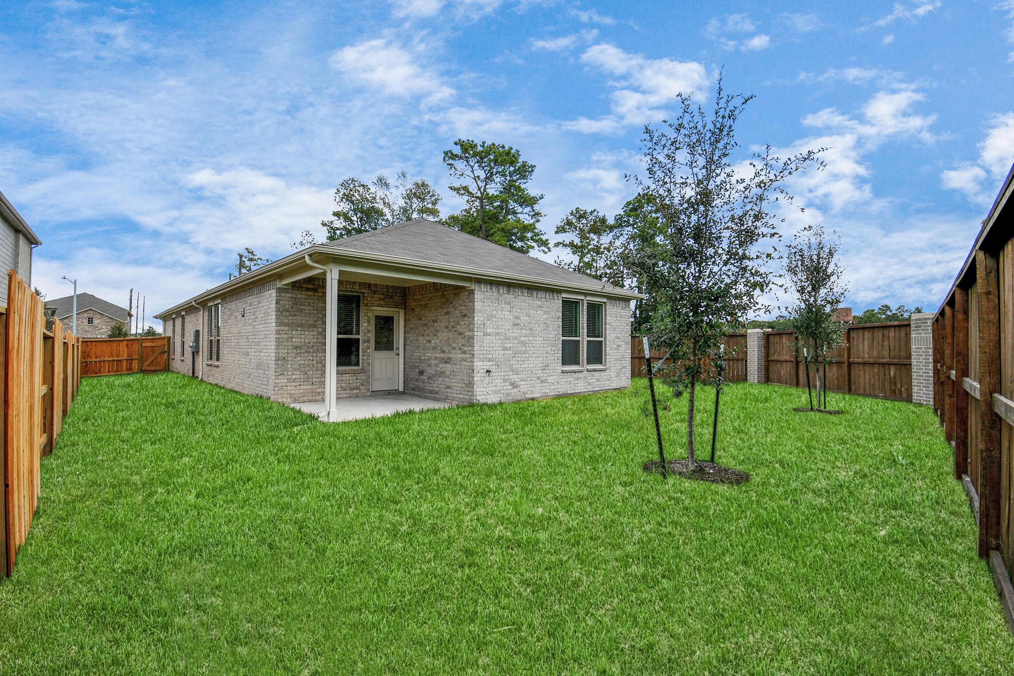 Spacious backyard with cover patio.