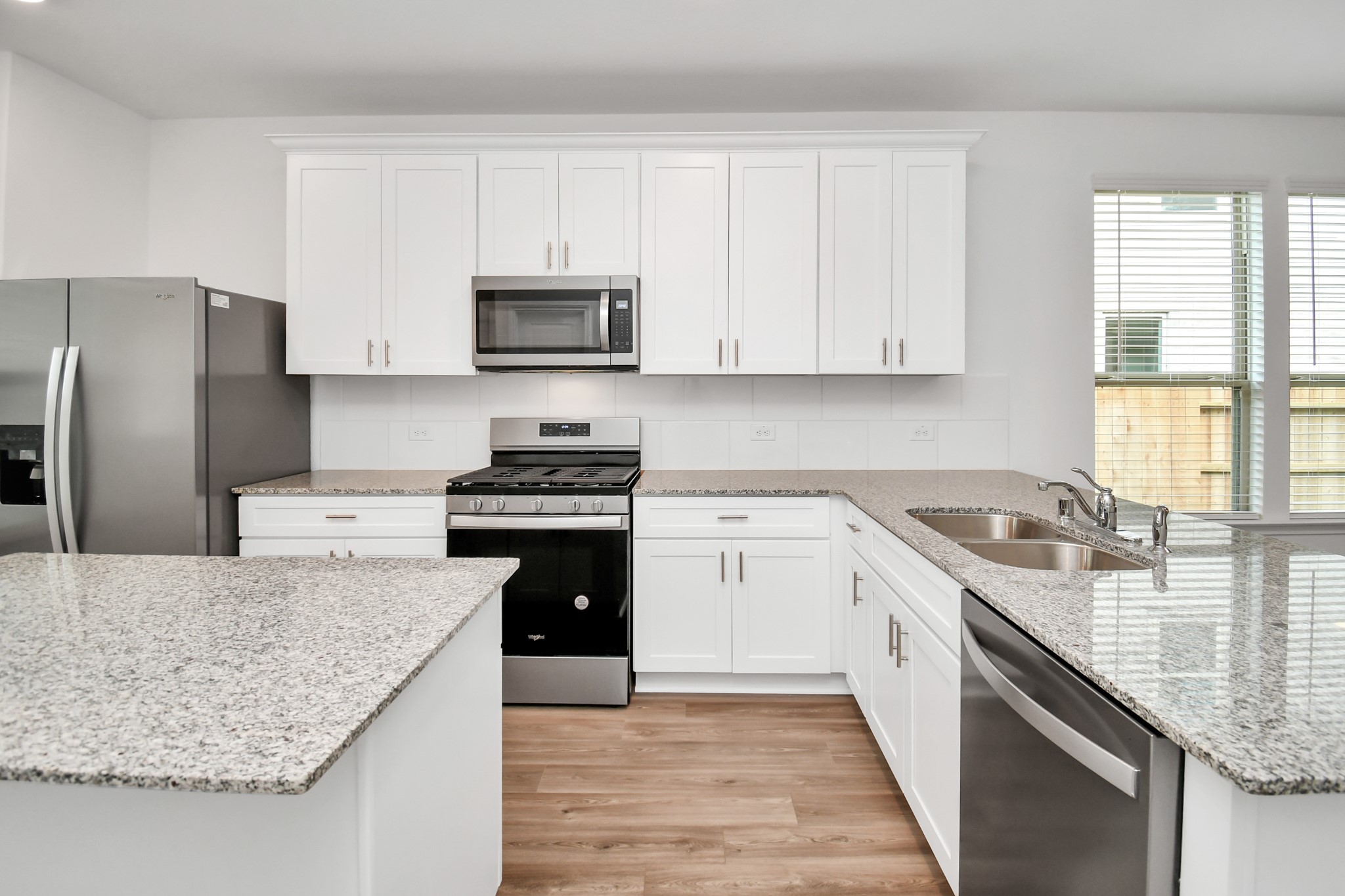 Not only does the kitchen have an island it also features a breakfast bar.