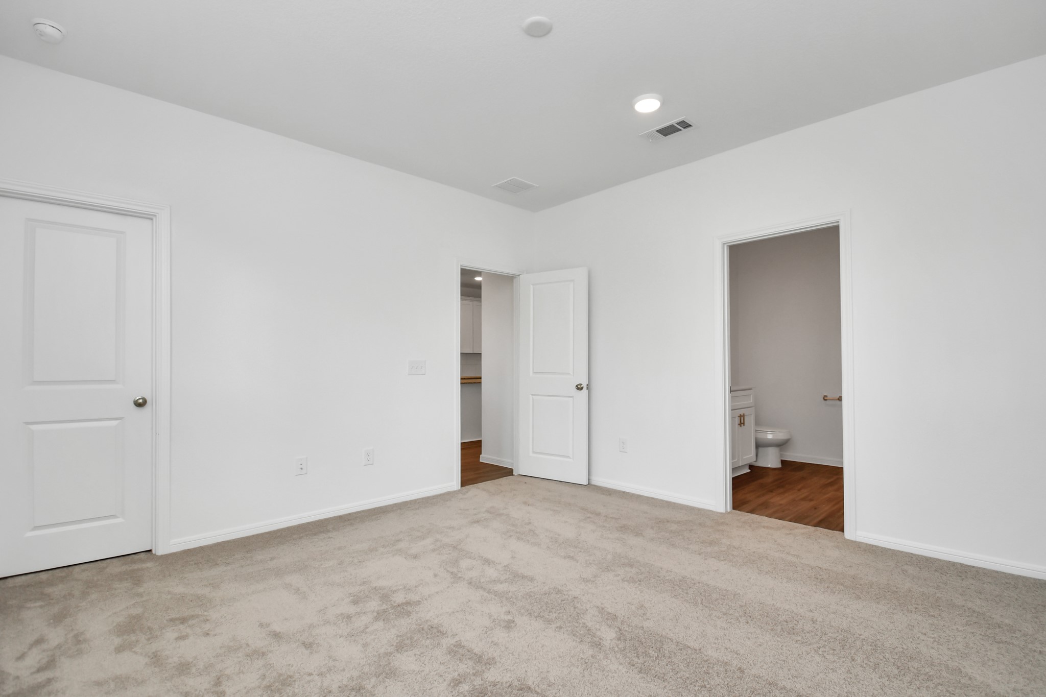 Another view of the Master Suite with with view of the bathroom.
