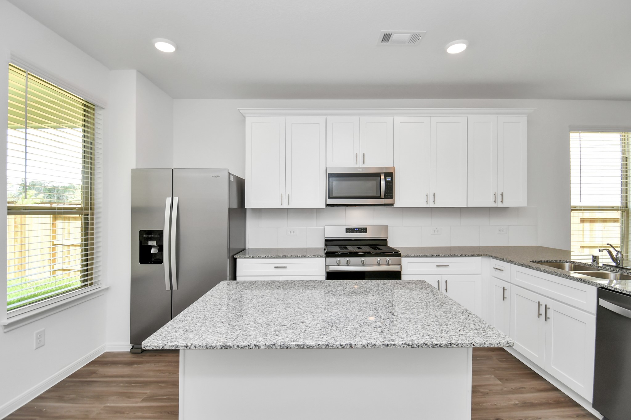 Kitchen featuring island and plenty of cabinet space.