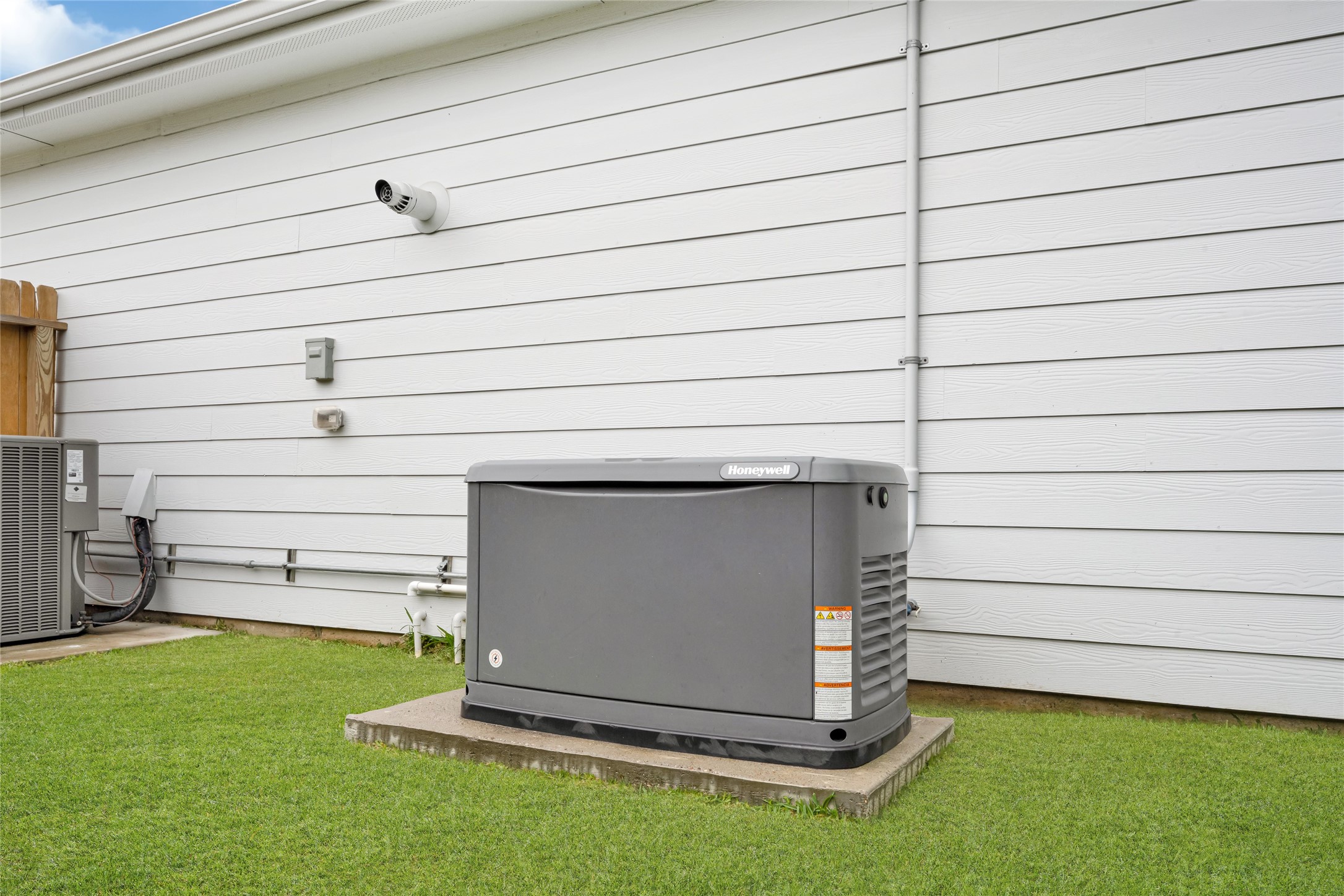 Whole-home backup generator on a dedicated concrete pad  because in Houston, that's not a luxury, it's a necessity. Storm season ready from day one.