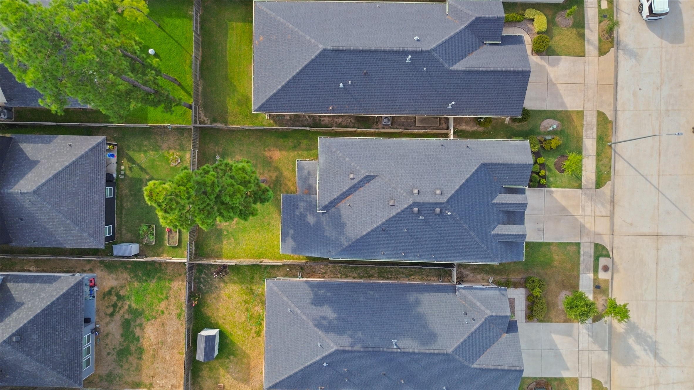 From above, you can appreciate how your home fits into the neighborhood, with a fenced backyard and outdoor space all your own.