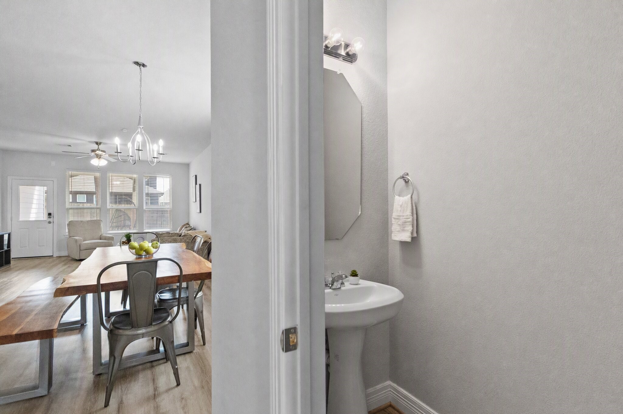 Your convenient powder room sits just off the main living areas, making it easy for guests to freshen up without heading upstairs. This photo has been digitally edited.