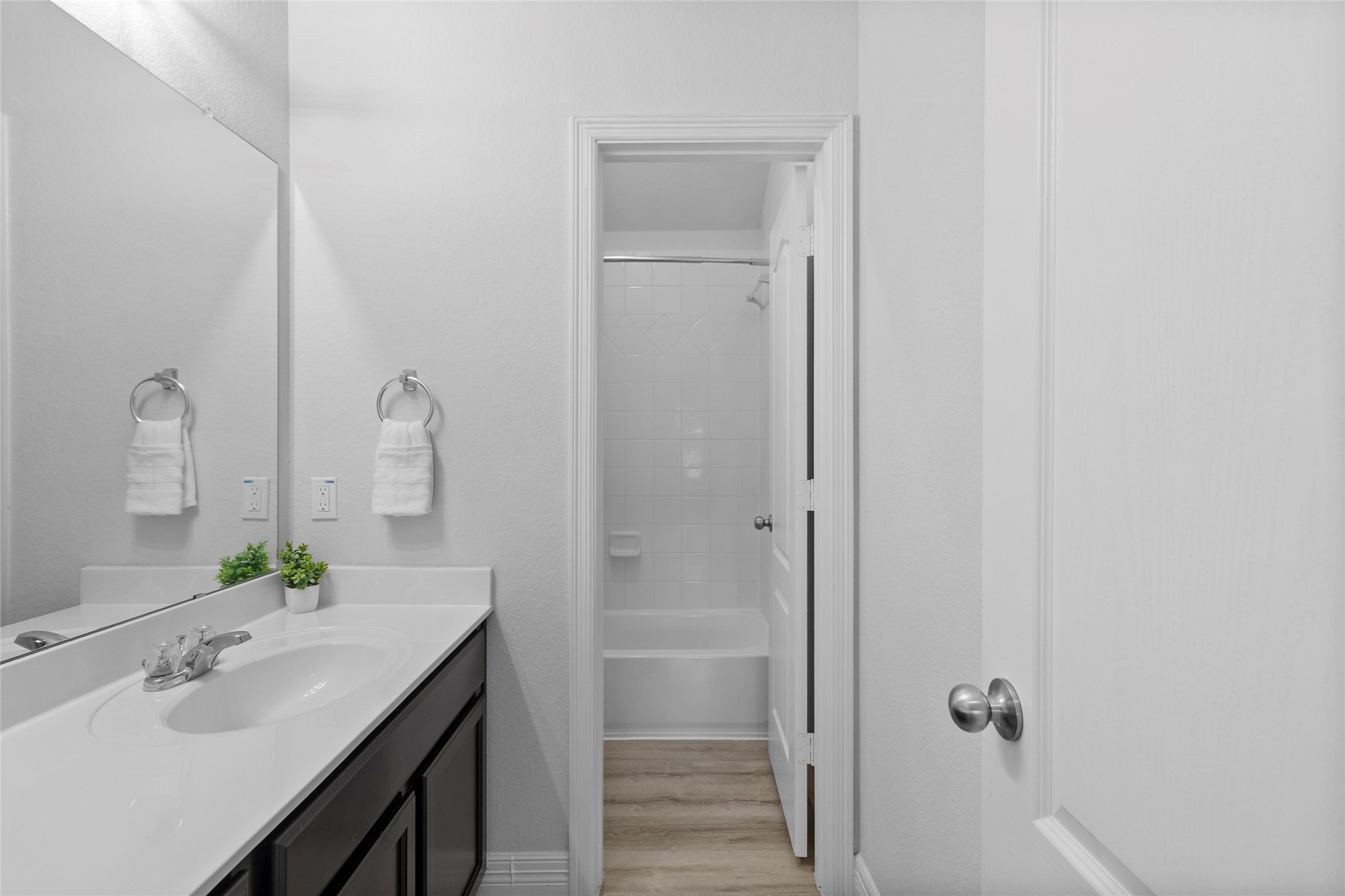 Your bathroom keeps the morning routine easy with a spacious vanity, generous counter space, and a separate area for added privacy.