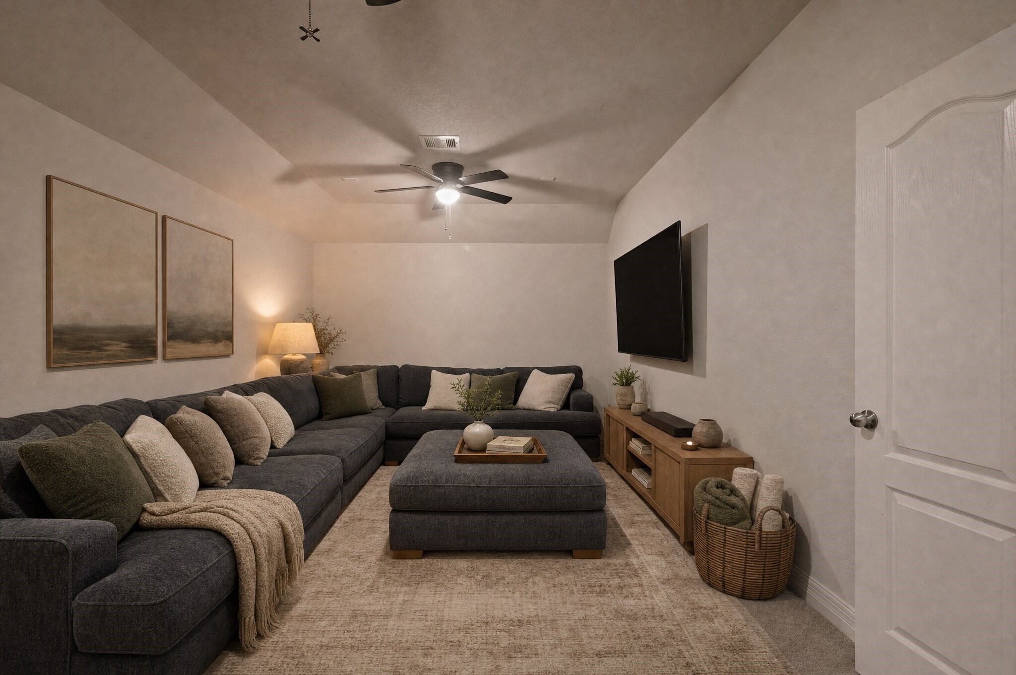 Movie nights feel right at home in this cozy upstairs retreat, with plenty of space to stretch out and settle in. This photo has been digitally edited.