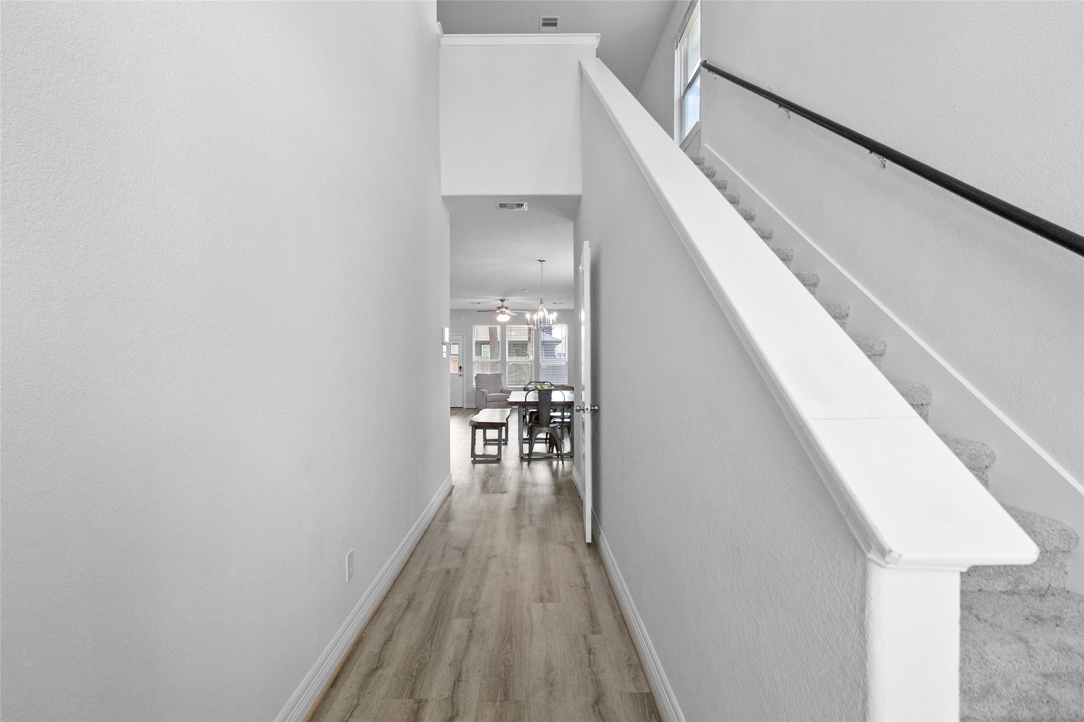 Heading upstairs feels open and airy, with clean sightlines that connect the different levels of your home.