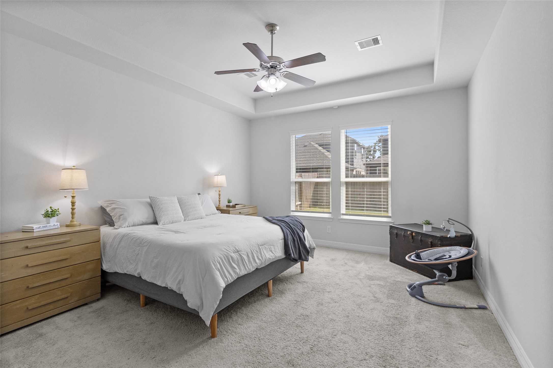 Waking up is easy in this bright, comfortable bedroom, where soft natural light and generous space create a relaxing start to the day