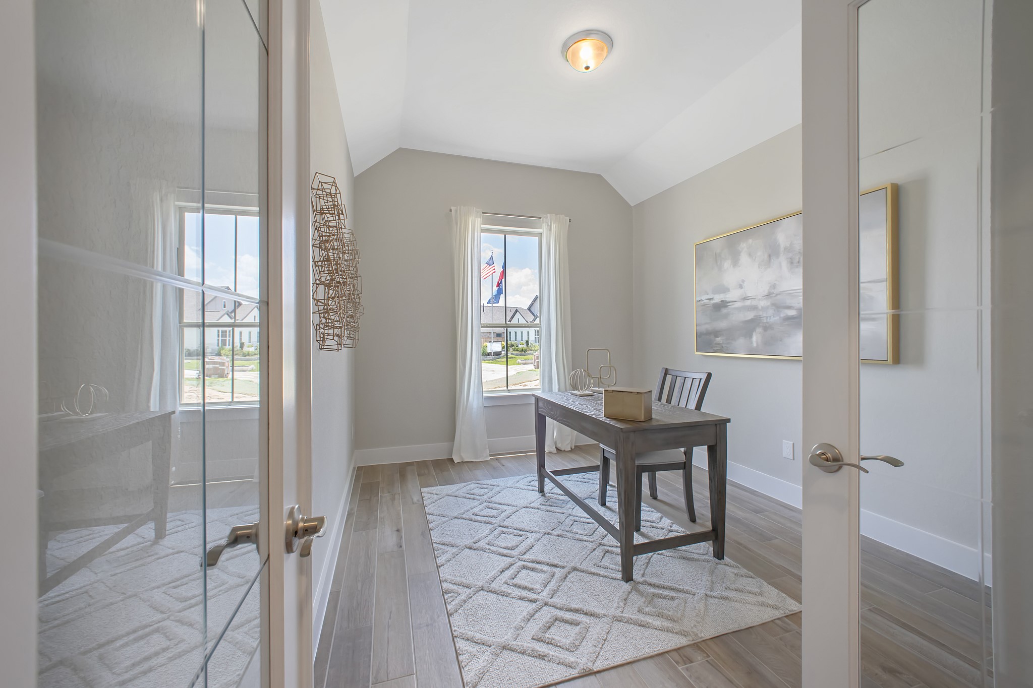 Step into the inviting home office, where elegant tile flooring adds a touch of freshness and comfort to the workspace. Natural light pours through the window, creating an inspiring environment for productivity and focus.
