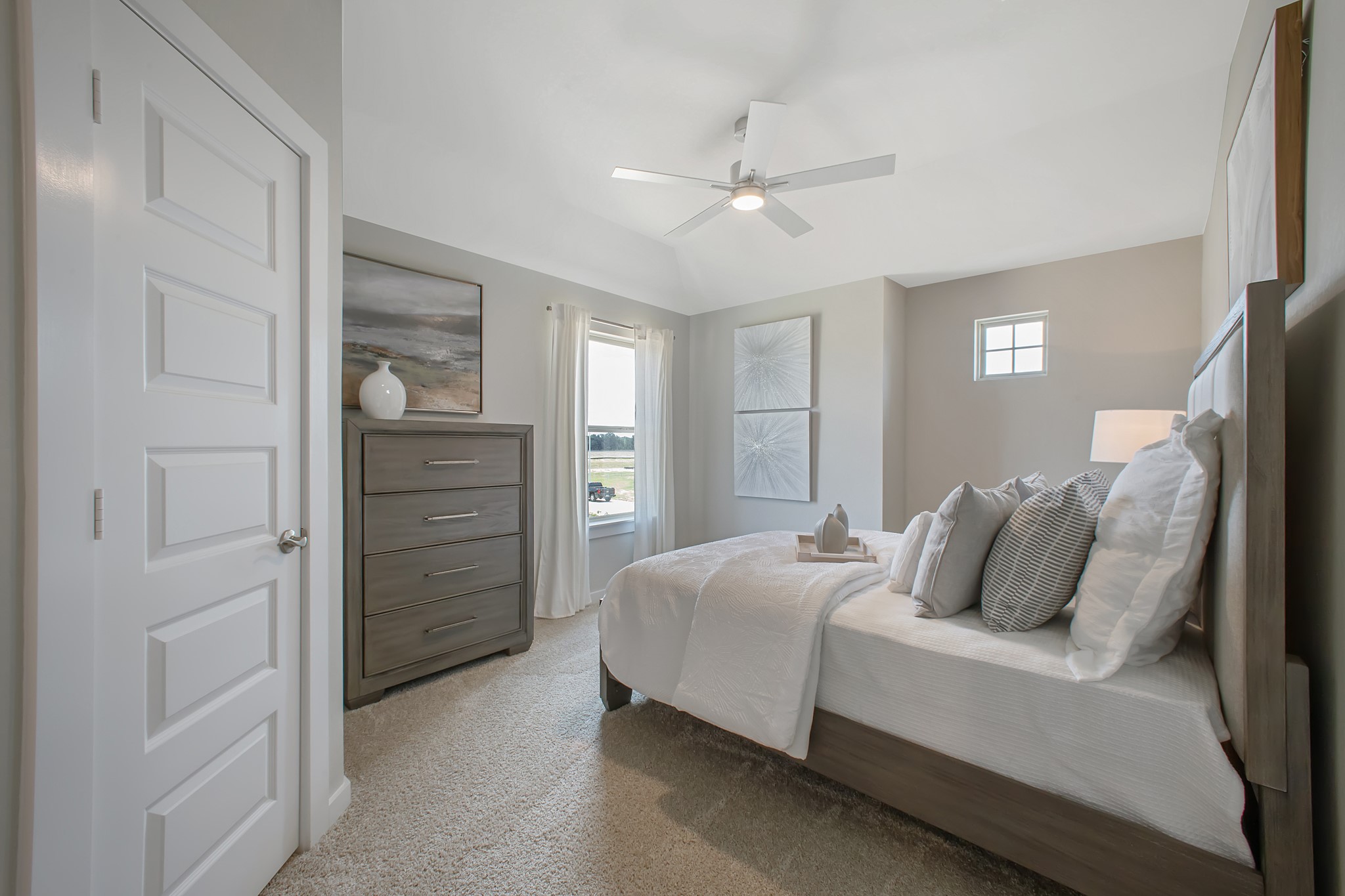 Generously sized secondary bedrooms featuring spacious closets, soft and inviting carpeting underfoot, large windows allowing plenty of natural light, and the added touch of privacy blinds for your personal retreat.