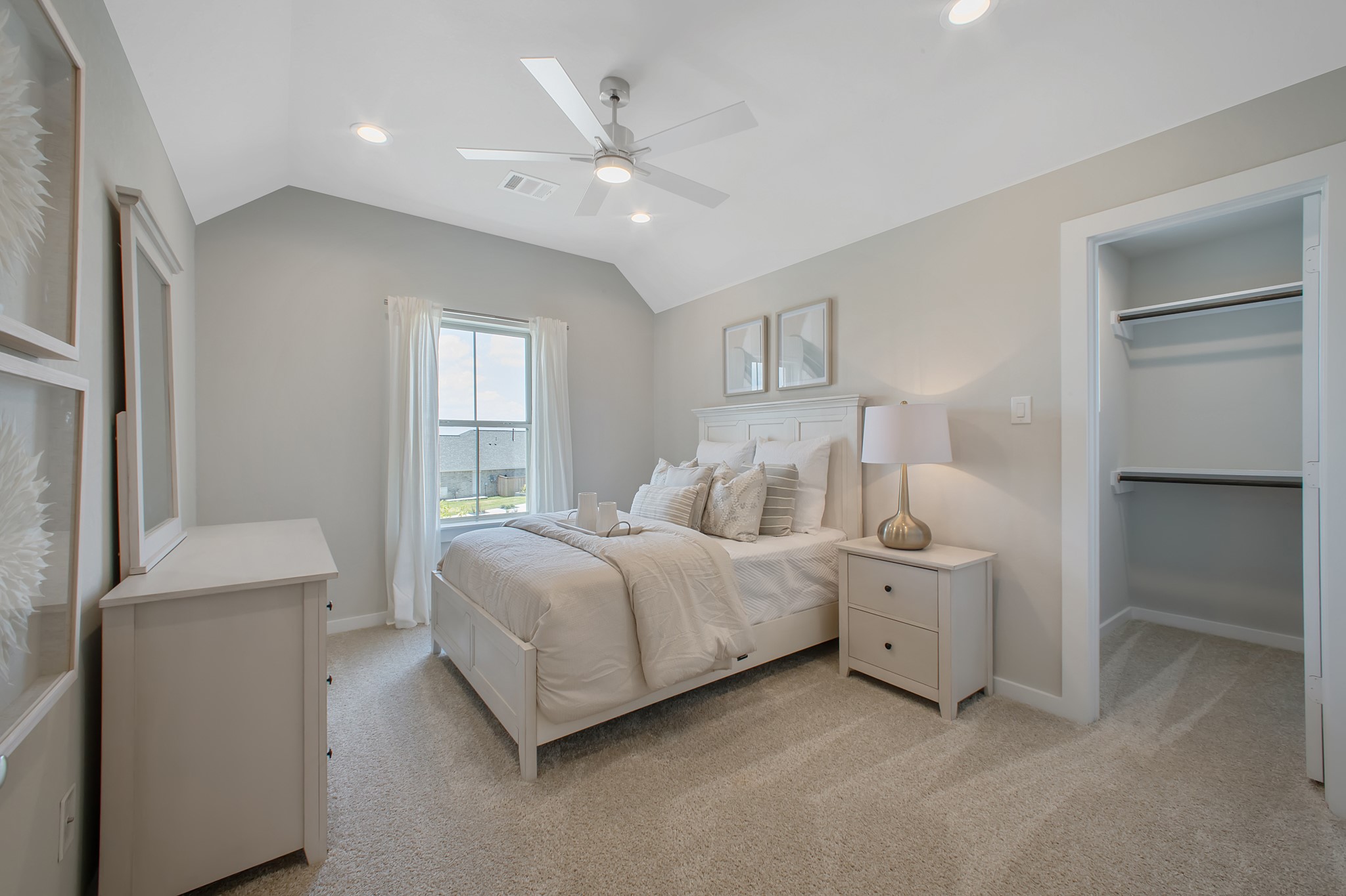 Generously sized secondary bedrooms featuring spacious closets, soft and inviting carpeting underfoot, large windows allowing plenty of natural light, and the added touch of privacy blinds for your personal retreat.