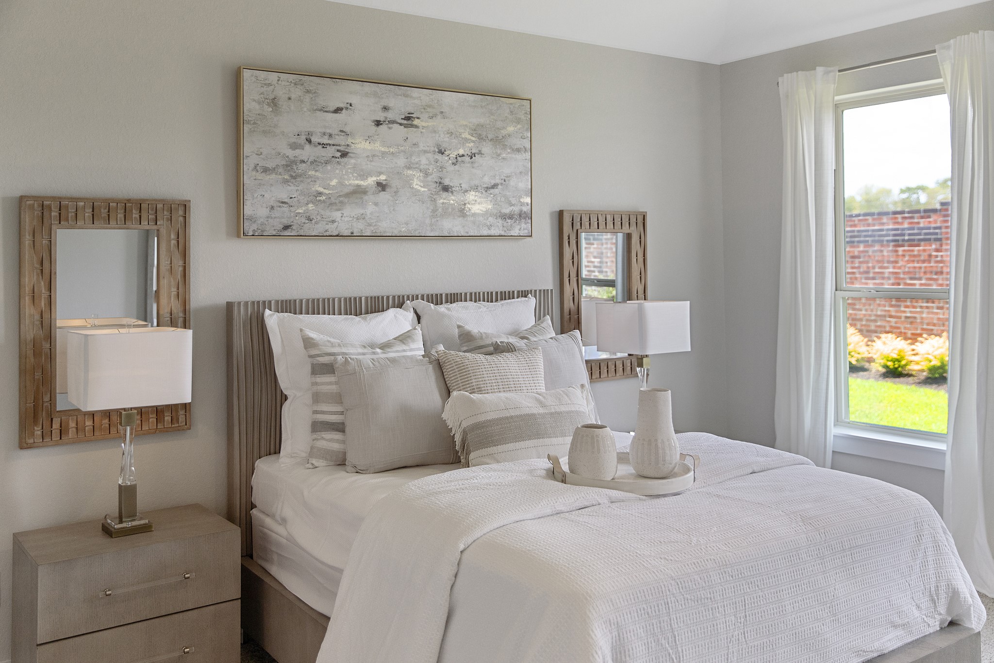 Generously sized secondary bedrooms featuring spacious closets, soft and inviting carpeting underfoot, large windows allowing plenty of natural light, and the added touch of privacy blinds for your personal retreat.
