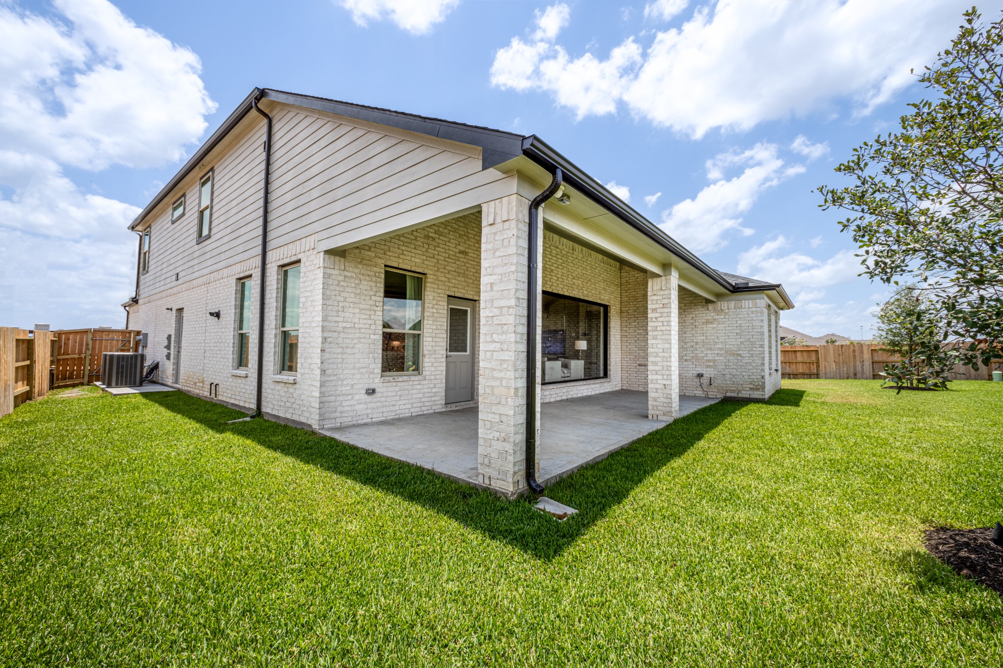 Come and see this spacious backyard with its beautiful covered patio. There is plenty of room for the kids to play and adults to relax. Perfect for your outdoor living space, patio furniture, bbq pit, and so much more. The possibilities are endless!