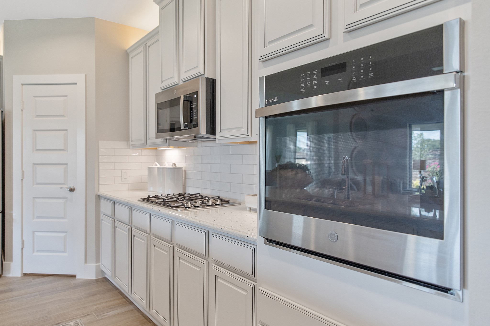The open concept effortlessly connects the kitchen to the expansive family room, forming a perfect hub for gatherings. This seamless flow creates an inviting space where cooking and socializing come together harmoniously.