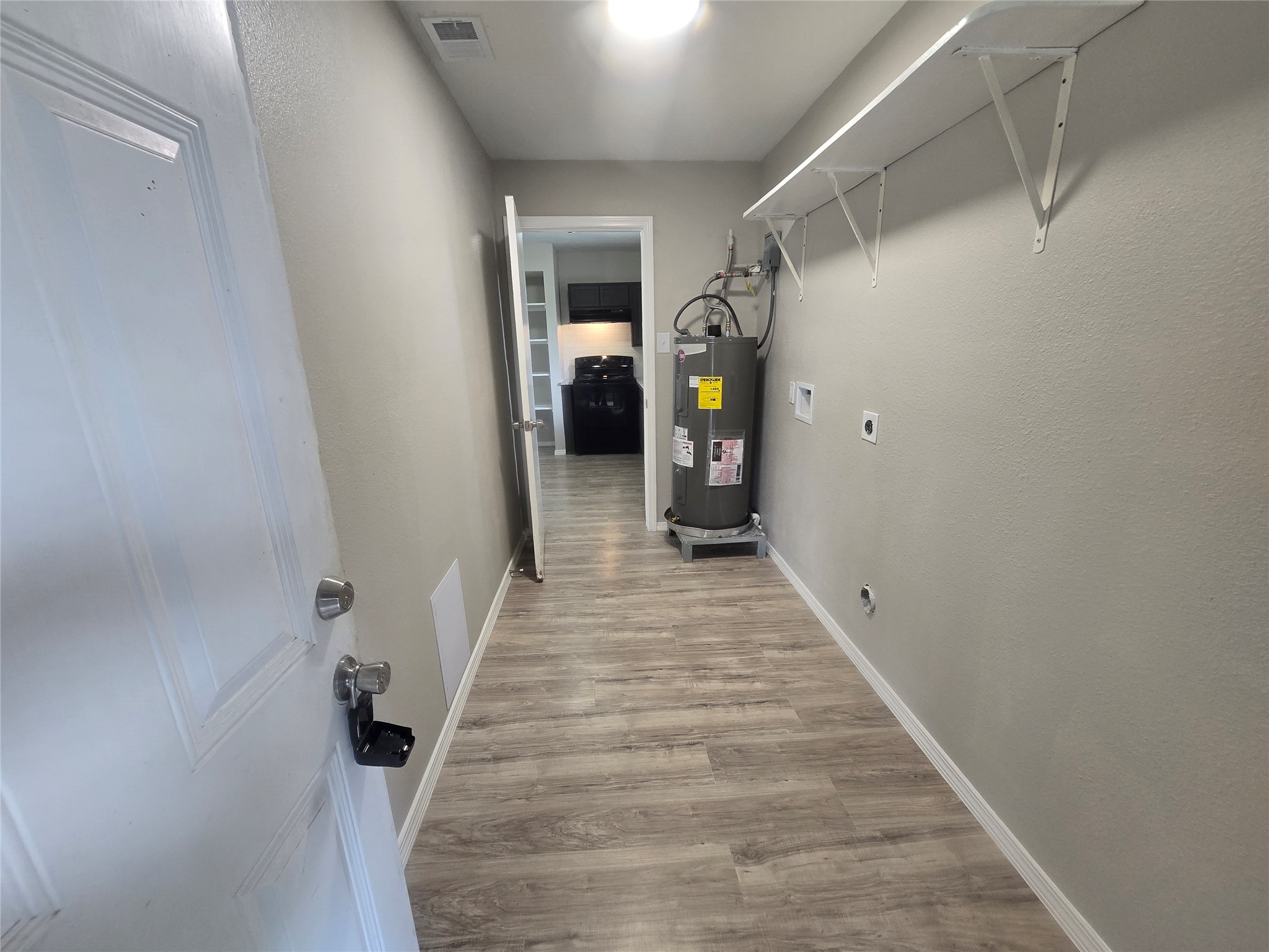 utility room with access from inside the house or from the carport