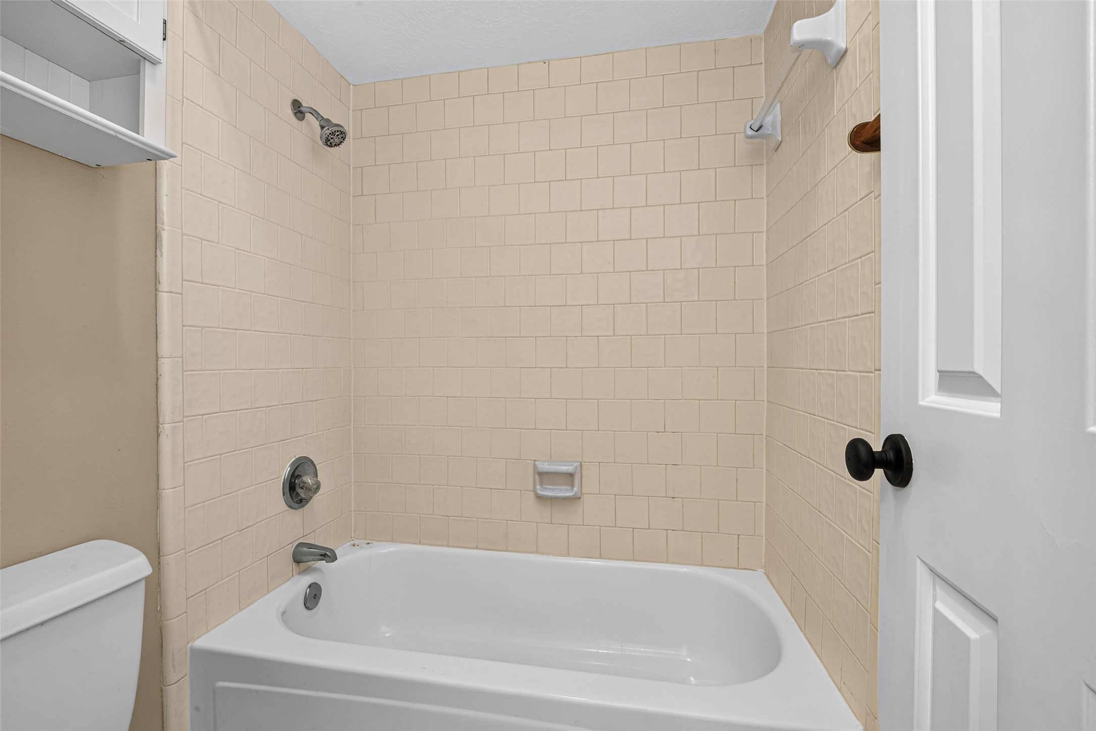 The secondary bath has a tub/shower combo.