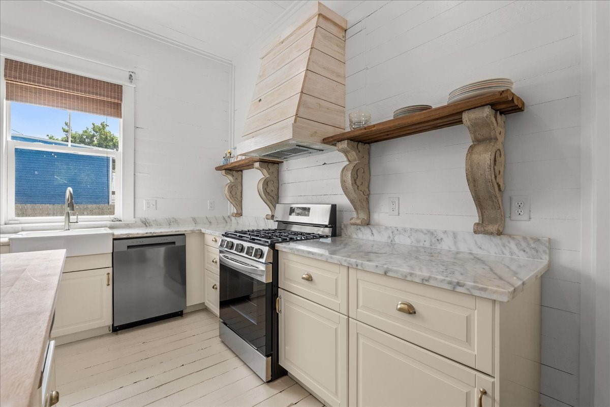 Kitchen detail with open shelving and updated finishes.