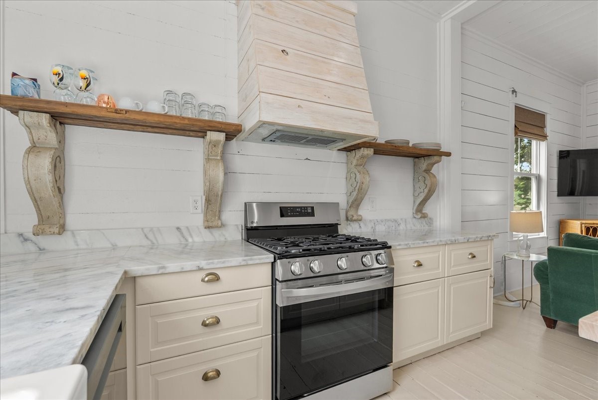 Efficient kitchen with stainless range and plenty of storage.