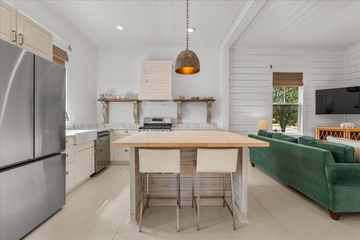 Functional kitchen layout with stainless steel appliances.