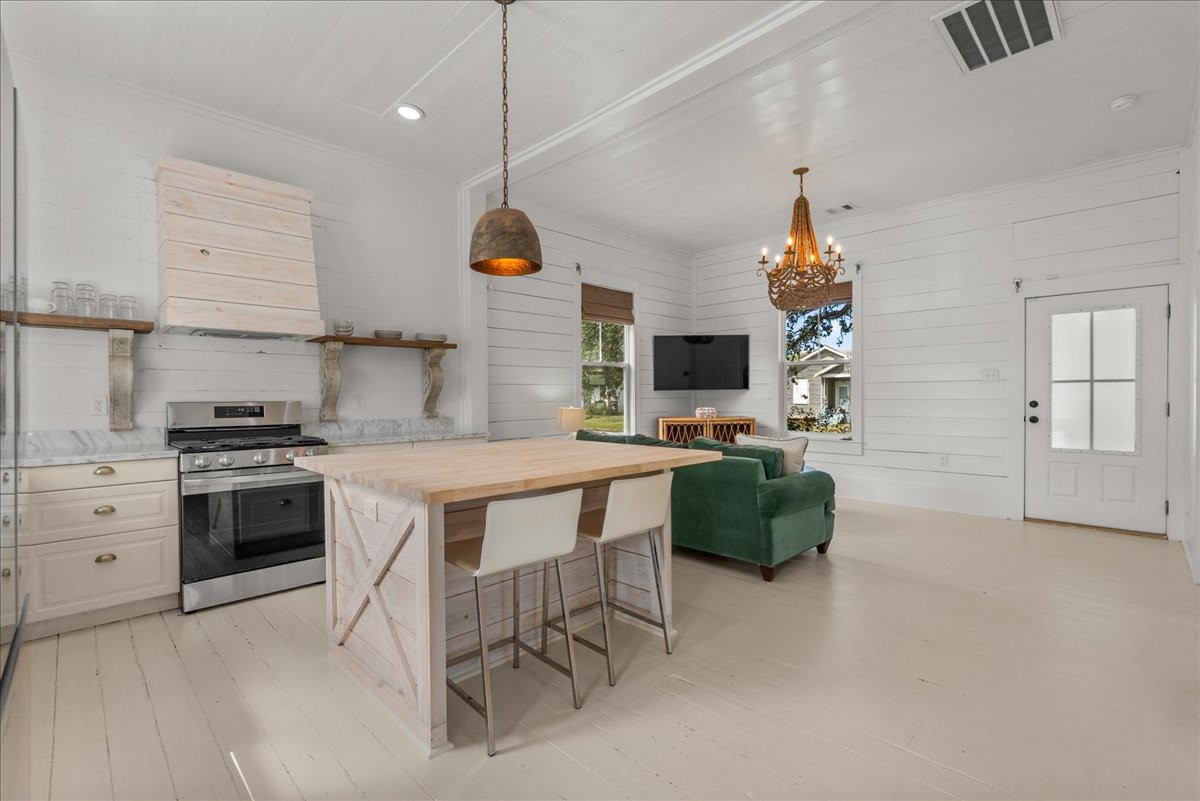 Light-filled kitchen with updated cabinetry and island seating.