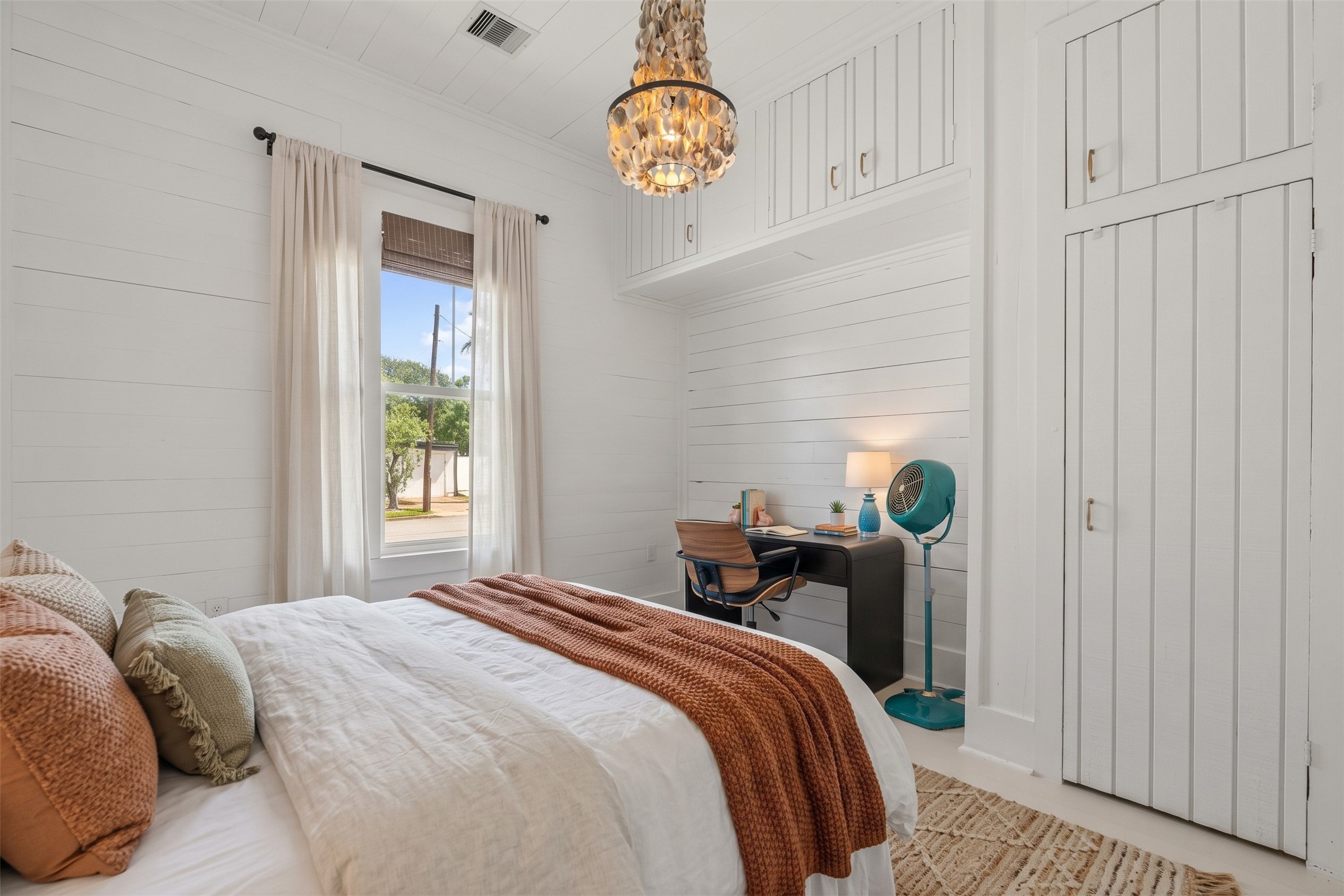 Bedroom with built-in storage and a cozy, inviting feel.