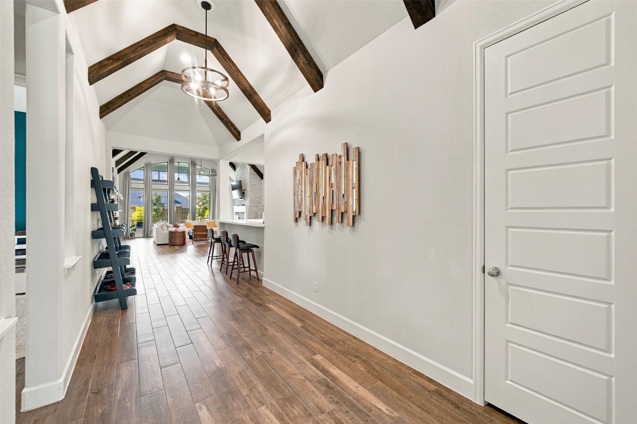 Custom beams installed throughout the entry and living room make this such a beautiful home to enter and enjoy. Custom beams installed throughout the entry and living room make this such a beautiful home to enter and enjoy.