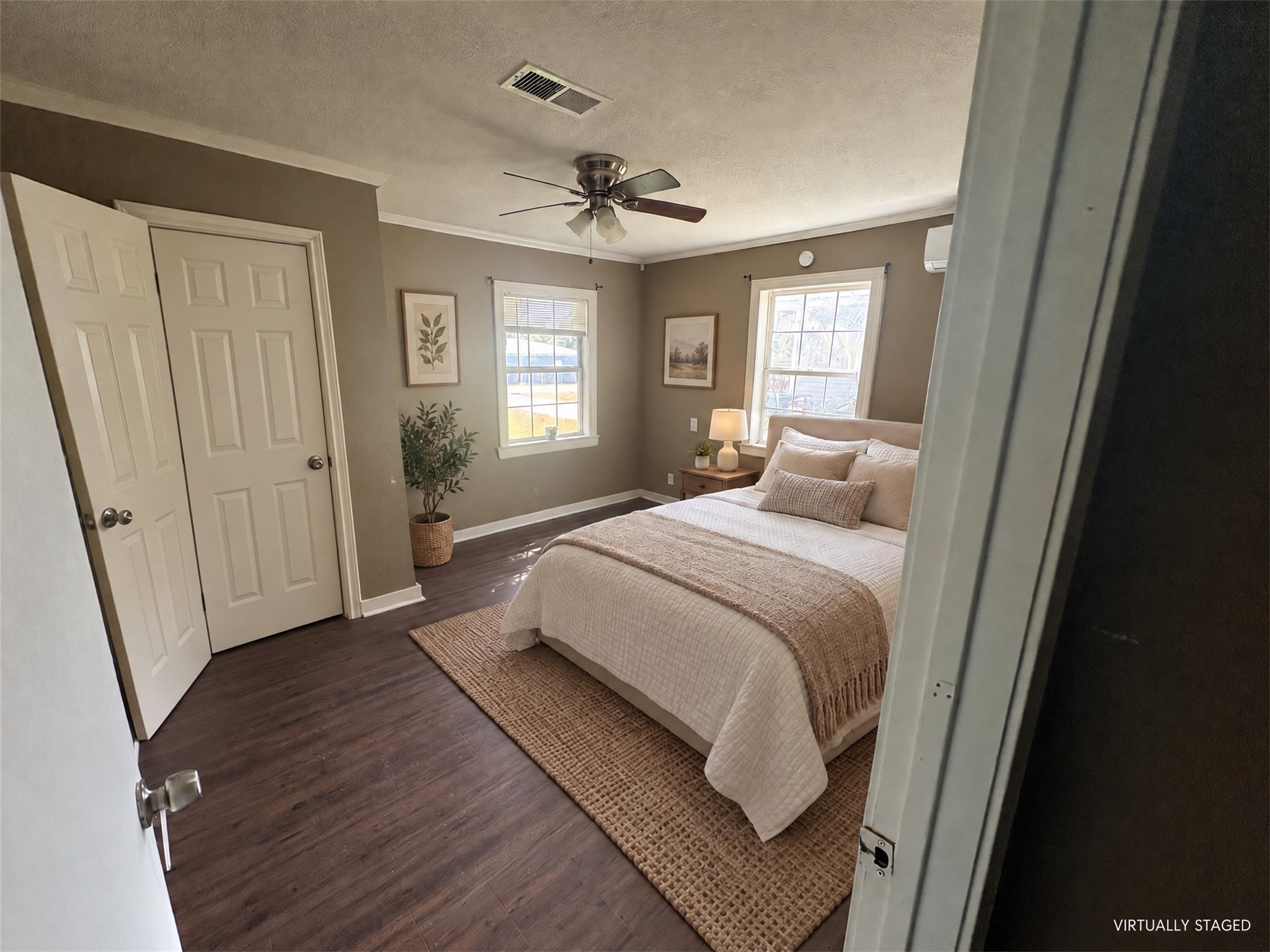 Virtually staged: simple furnishings show a possible bedroom arrangement without remodeling. Virtually staged: simple furnishings show a possible bedroom arrangement without remodeling.