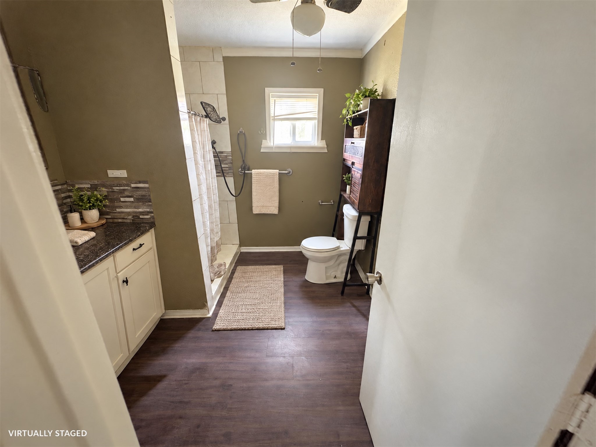 Virtually staged: towels and restrained accessories soften this existing bathroom.