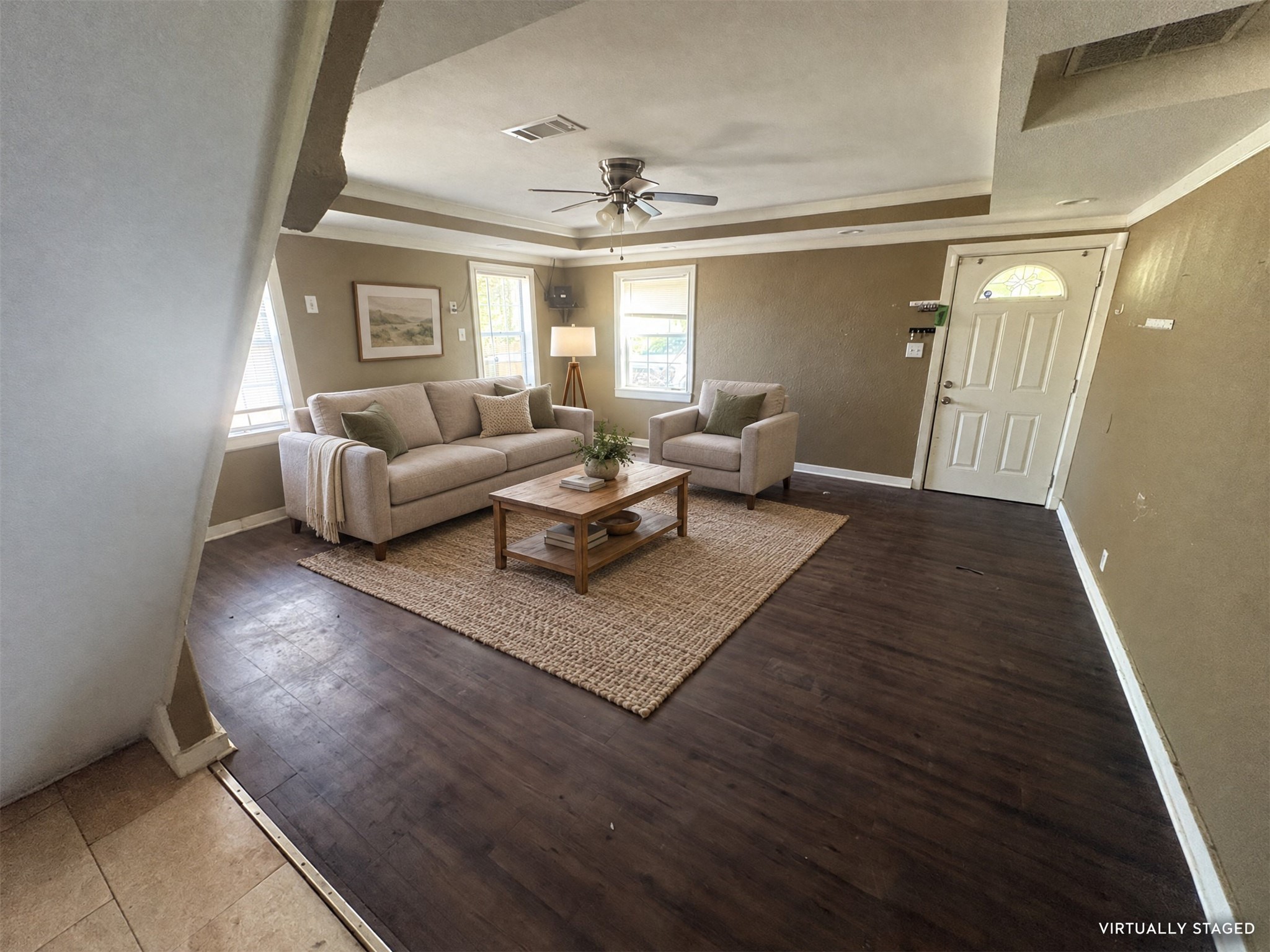 Virtually staged: a neutral seating arrangement illustrates one way to use the living room. Virtually staged: a neutral seating arrangement illustrates one way to use the living room.