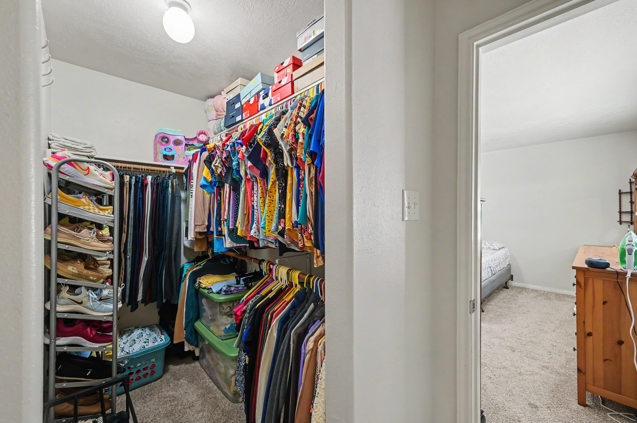 Spacious walk-in primary closet.