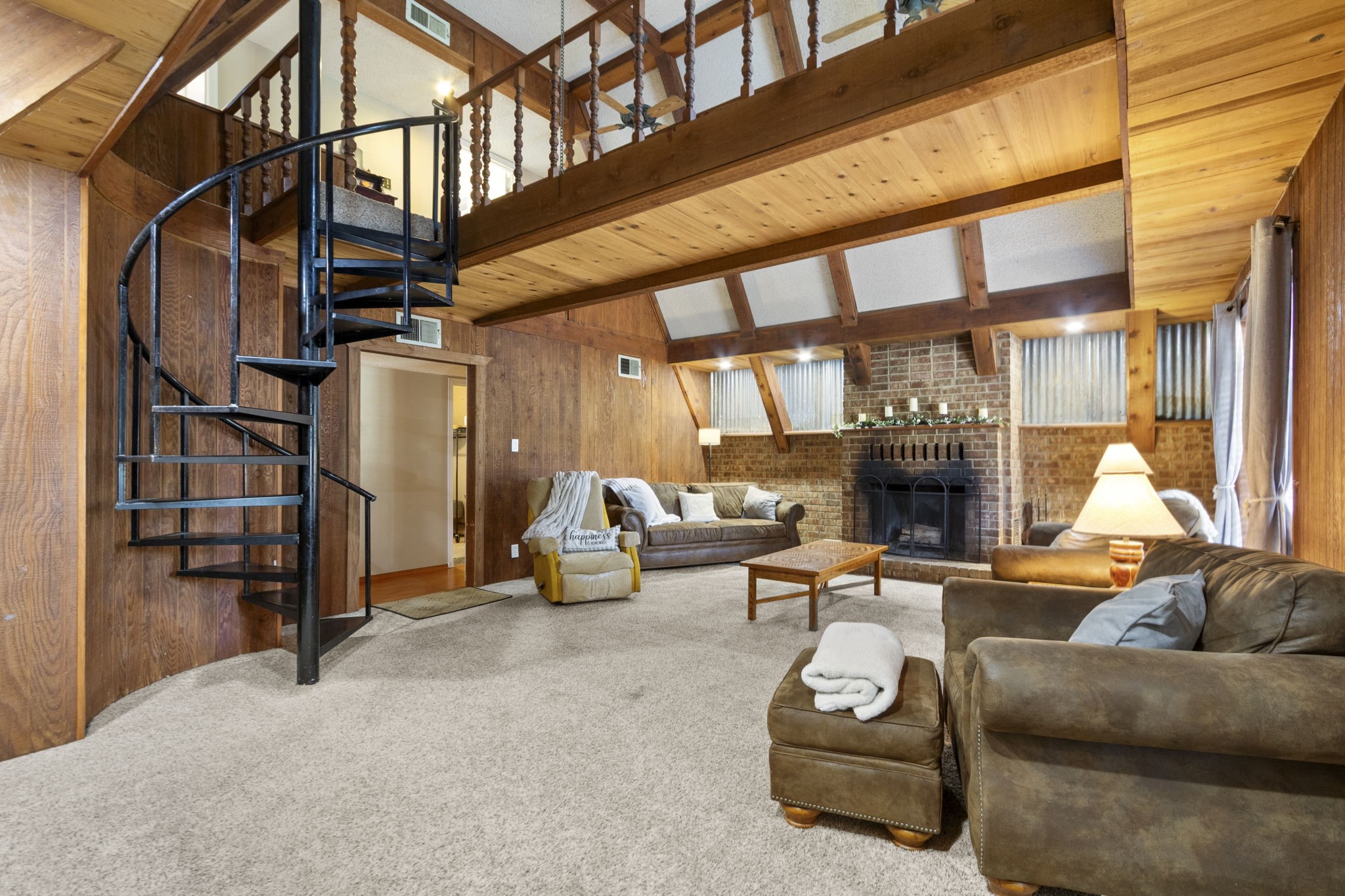 A staircase that makes a statement.
The eye-catching spiral staircase becomes a beautiful centerpiece, leading to two generously sized bedrooms, a full bathroom, and plenty of convenient storage space.