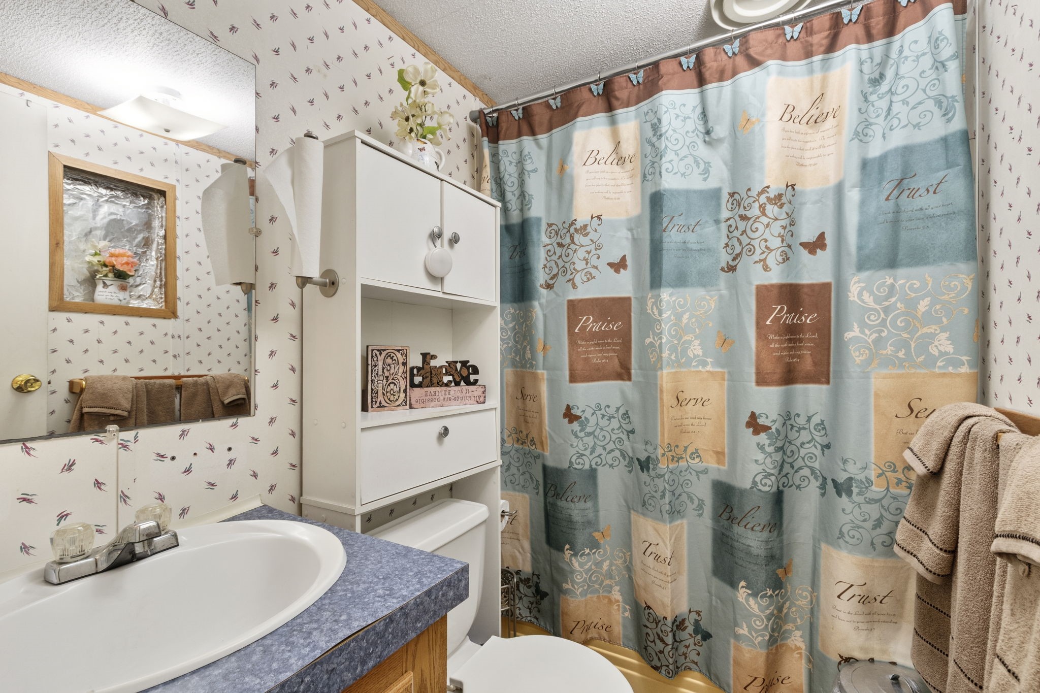 The secondary bathroom features a tub and shower combination, conveniently serving guests, the second bedroom, or a private office space.