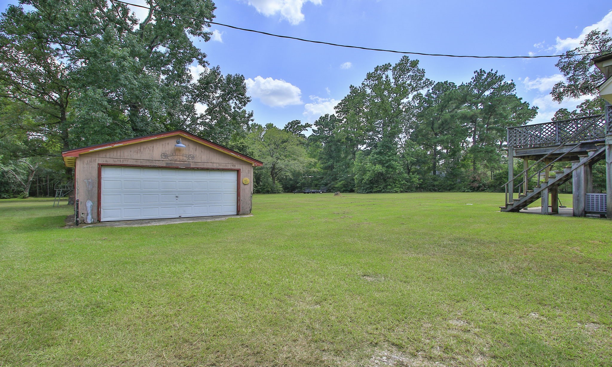 The detached two-car garage provides additional parking, storage, or flexible workspace.