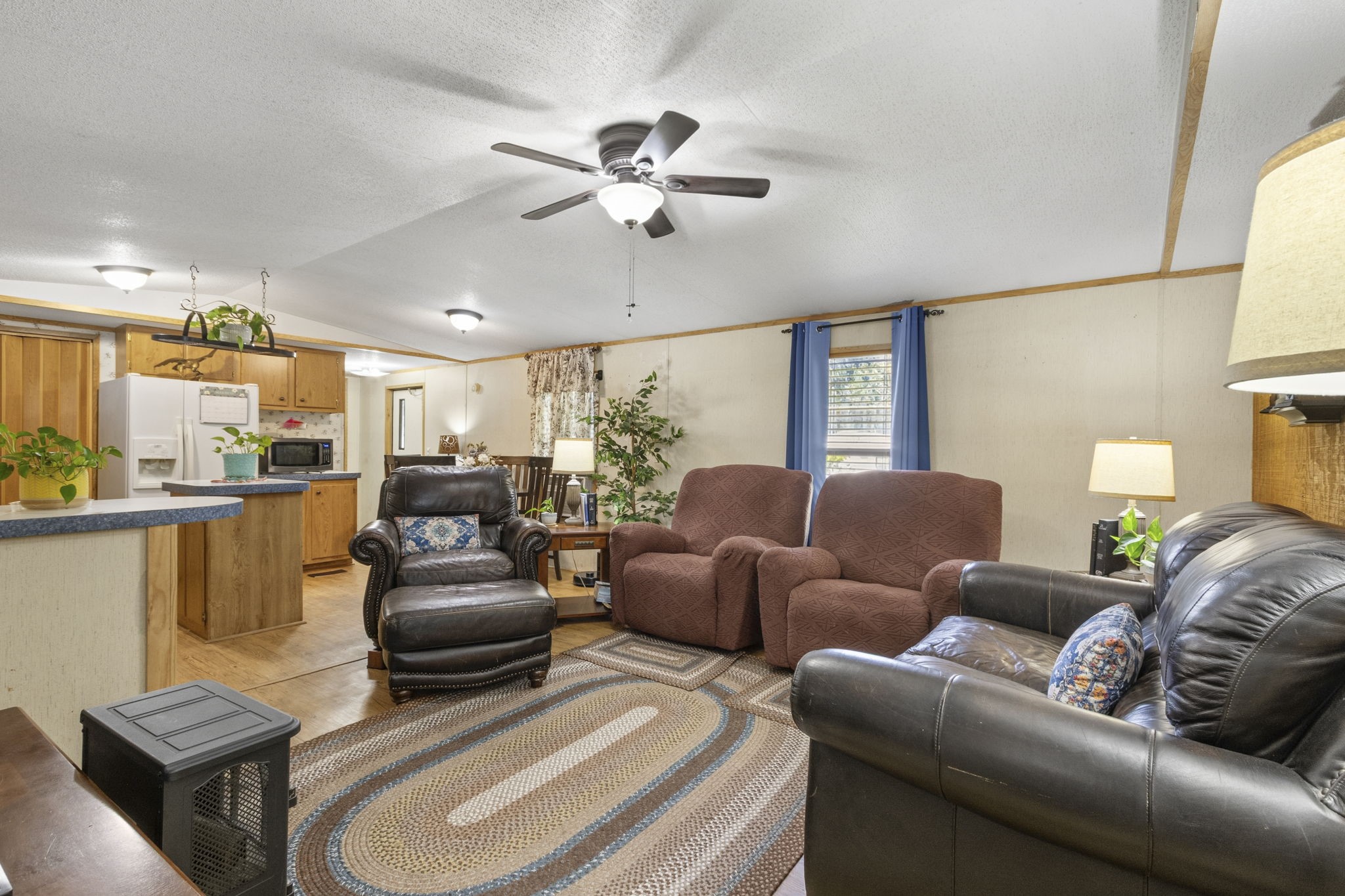 Inside, the second home offers a comfortable living room, kitchen, two bedrooms, and two full bathrooms.