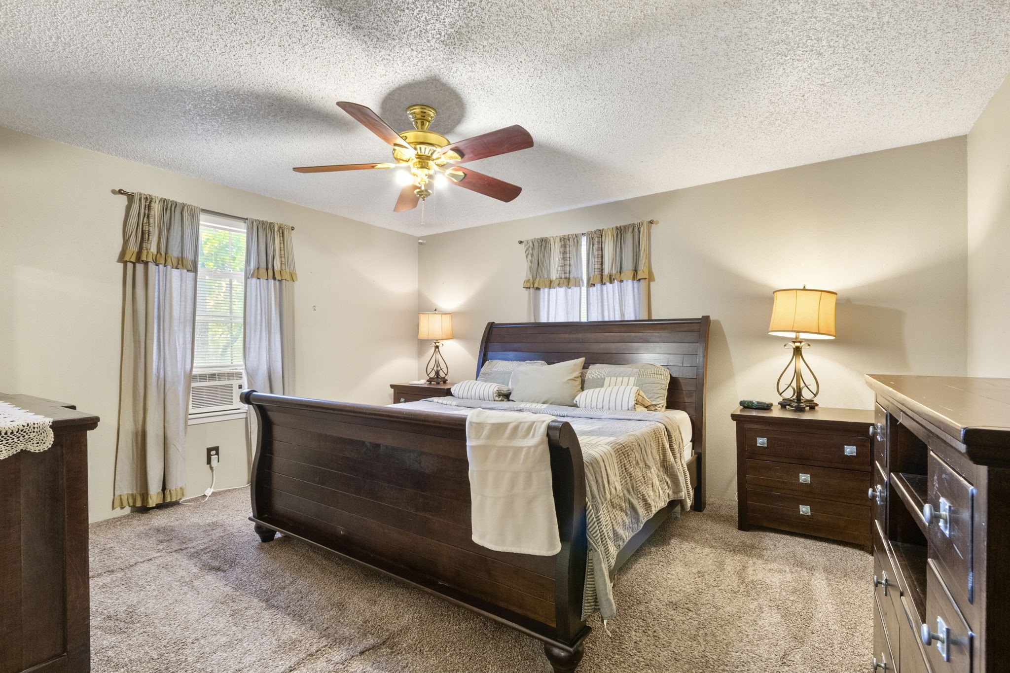 First-floor primary bedroom for added convenience.
The home features central HVAC, plus an additional window unit in the primary bedroom because the sellers enjoy keeping their space extra cool and comfortable.