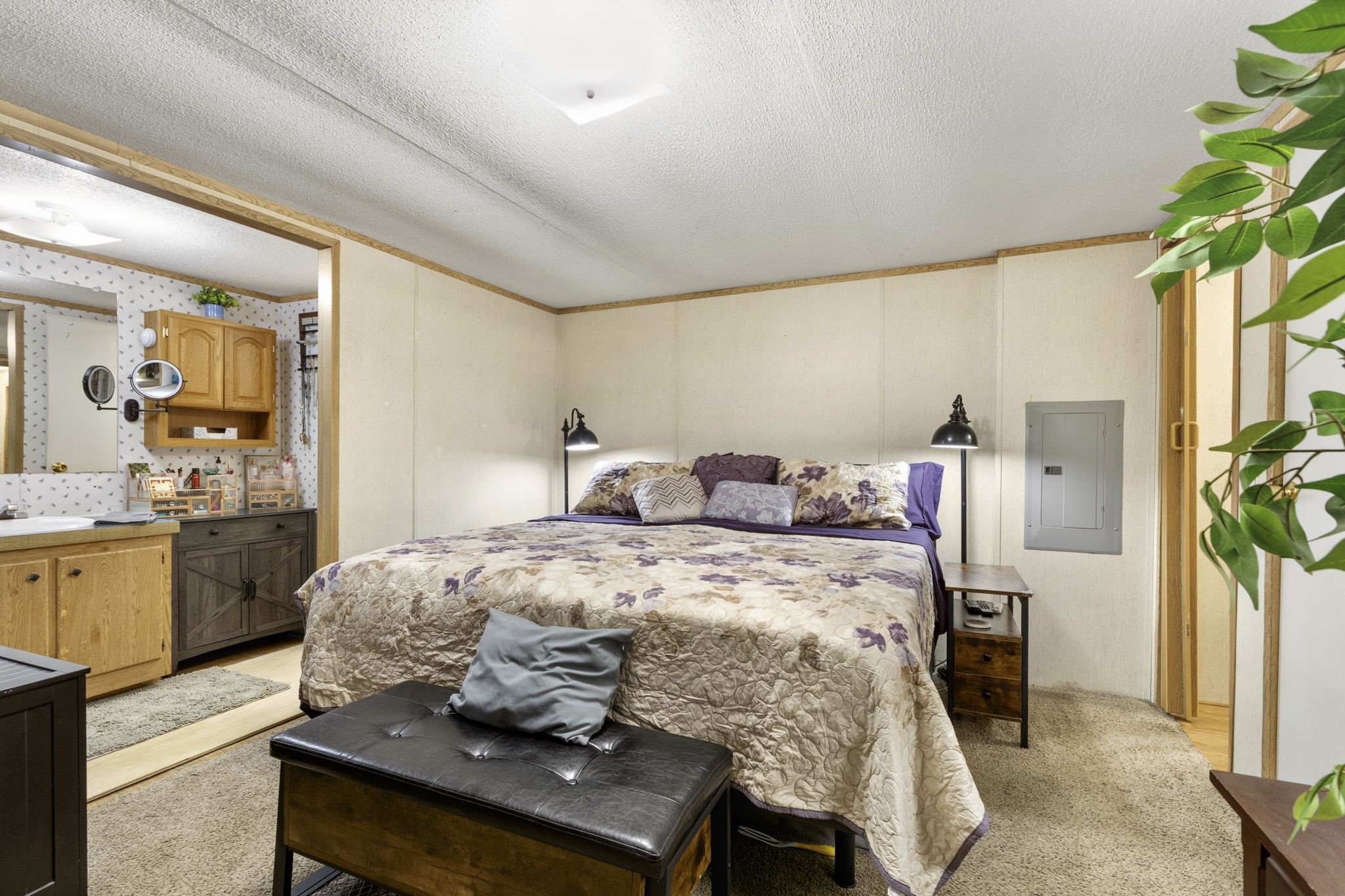 The second home offers two bedrooms, two bathrooms, a private septic system, and a shared well with the main home.