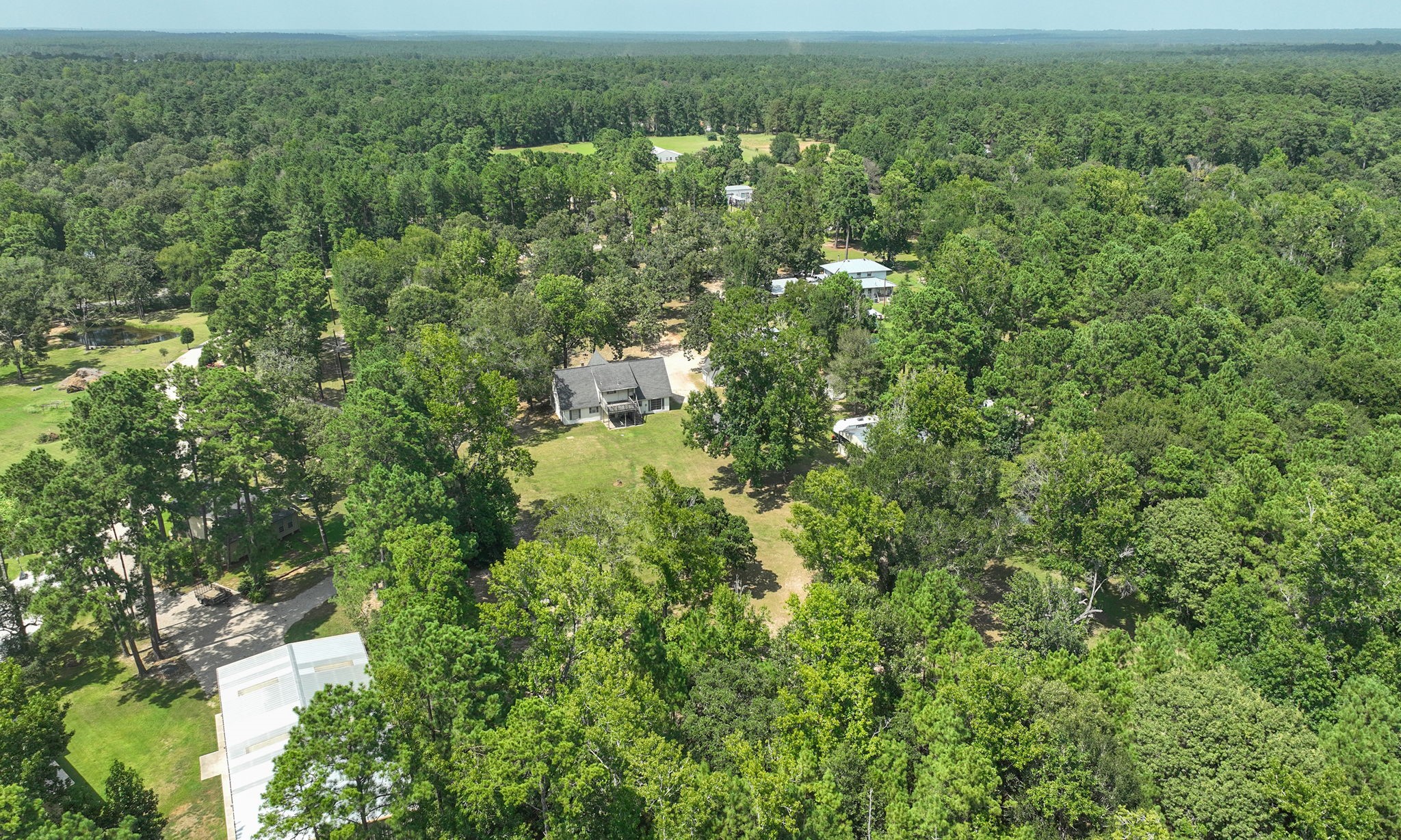 Create your very own outdoor pool retreat on 5 beautiful acres. Two homes, no HOA, low tax rate, private well, and separate septic systems offer flexibility and freedom. Create your very own outdoor pool retreat on 5 beautiful acres. Two homes, no HOA, low tax rate, private well, and separate septic systems offer flexibility and freedom.