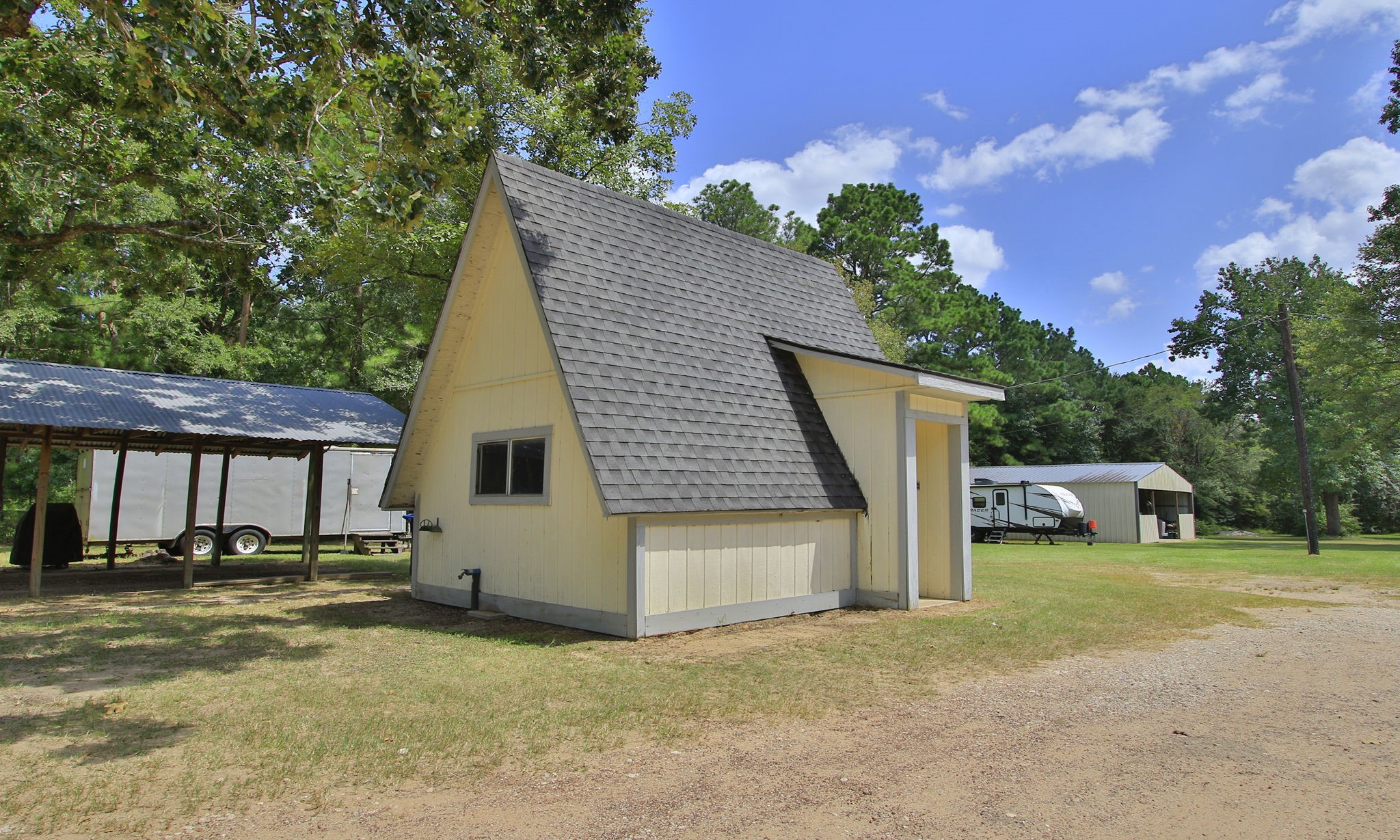 The property also includes a dedicated well house with additional space for tools, equipment, and storage.