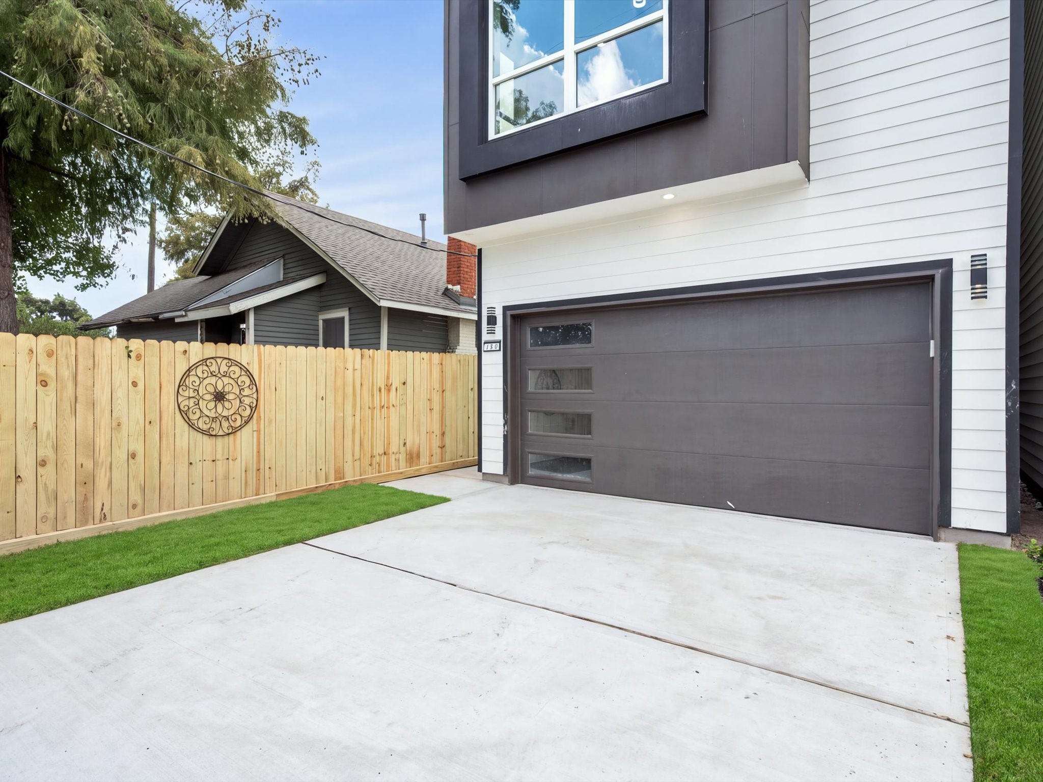 Sleek exterior finishes complement the homes modern design, with an attached private 2-car garage adding convenience.