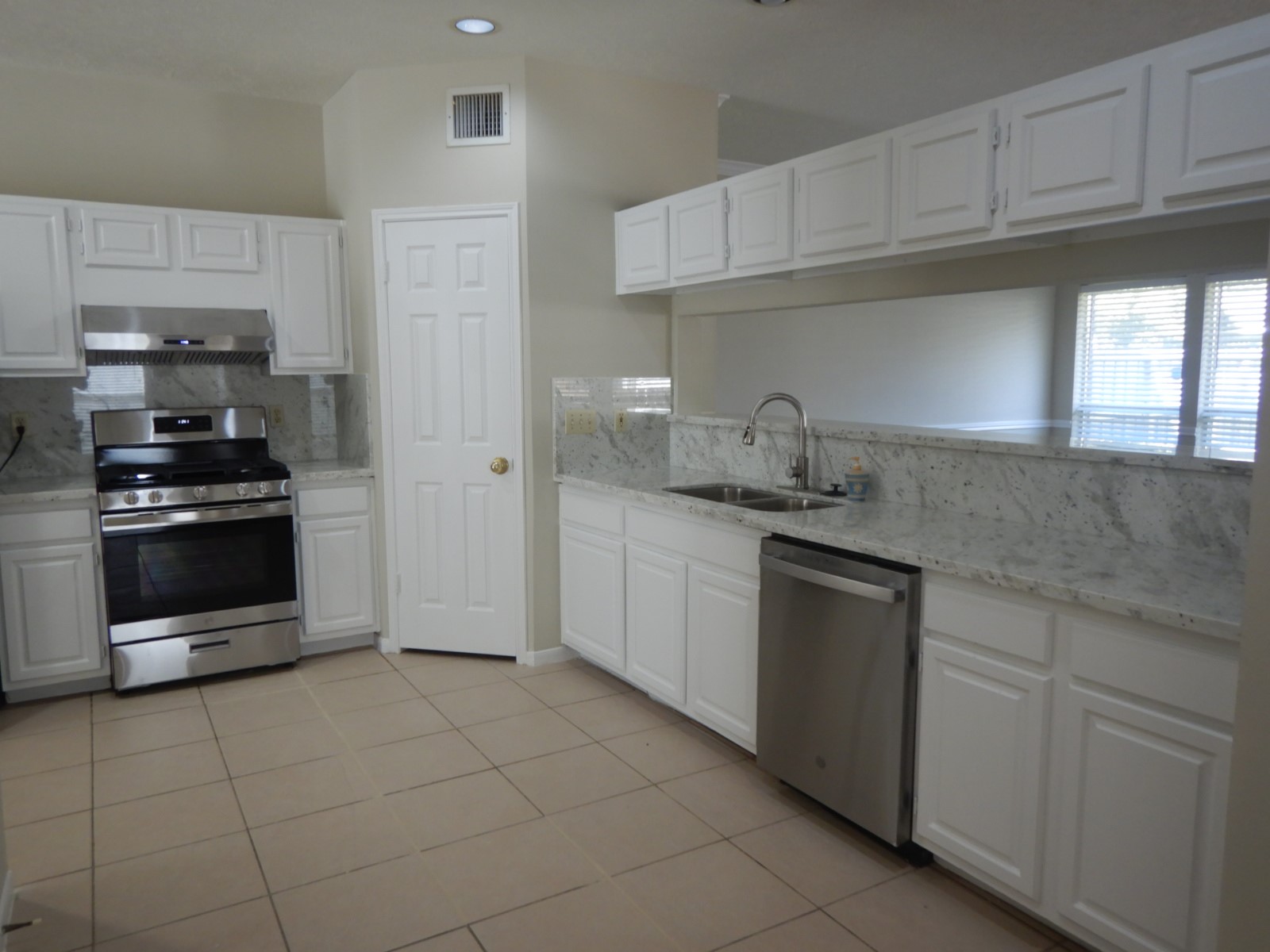 Updated kitchen with new granite counter tops and painted cabinetry Updated kitchen with new granite counter tops and painted cabinetry