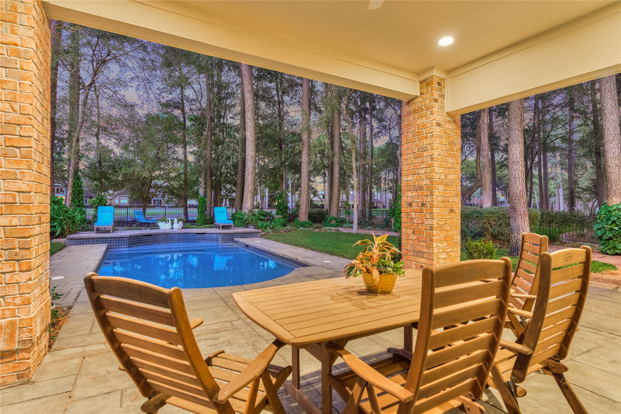 Take in the incredible views of the majestic trees and skyline from the patio.