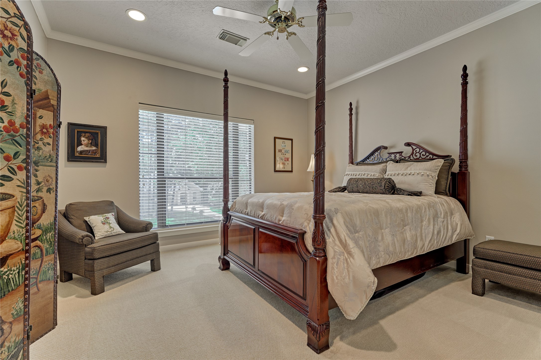 Bedroom #4 with walk-in closet and front yard views.