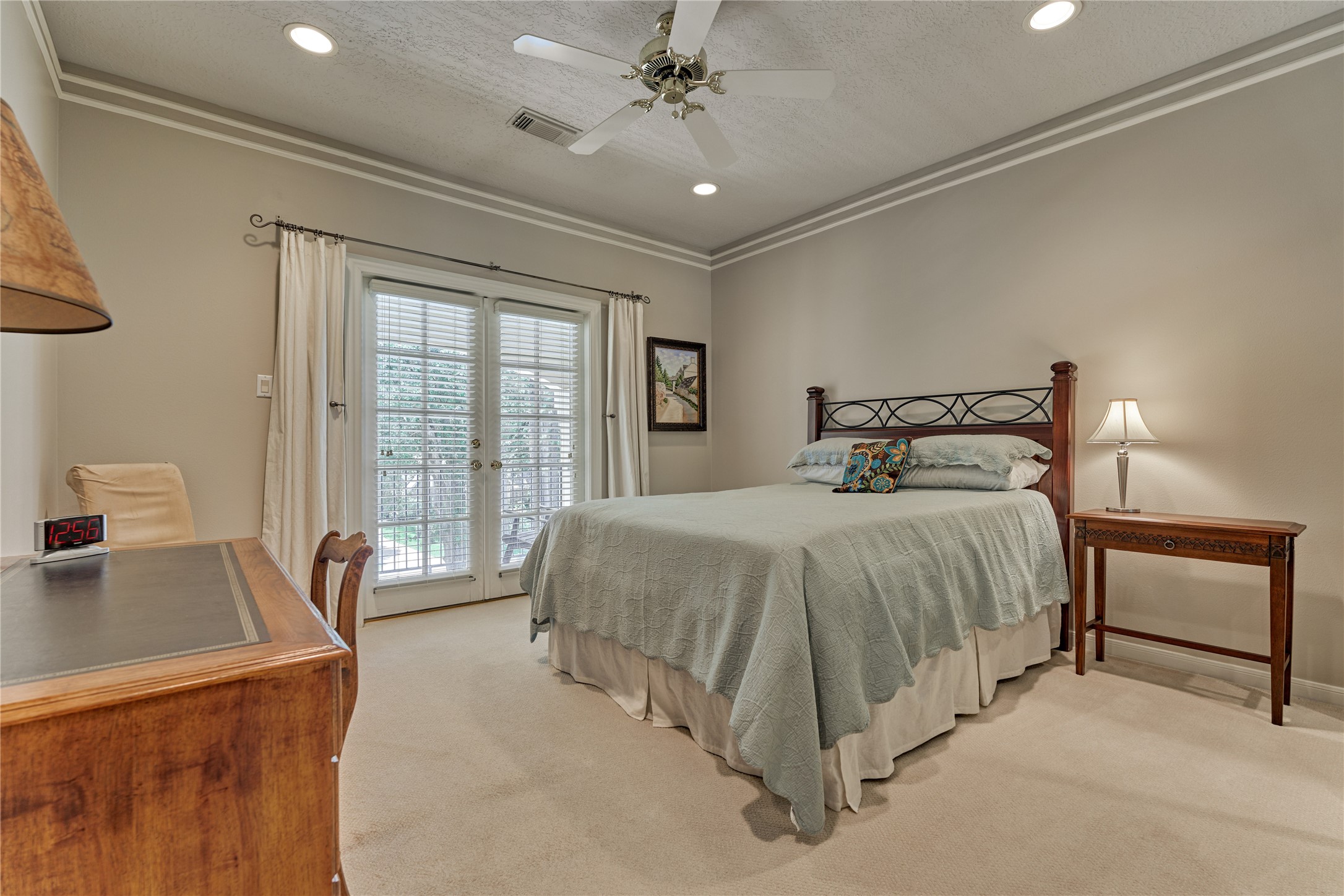 Bedroom #3 features French doors that open to a balcony overlooking the front yard.